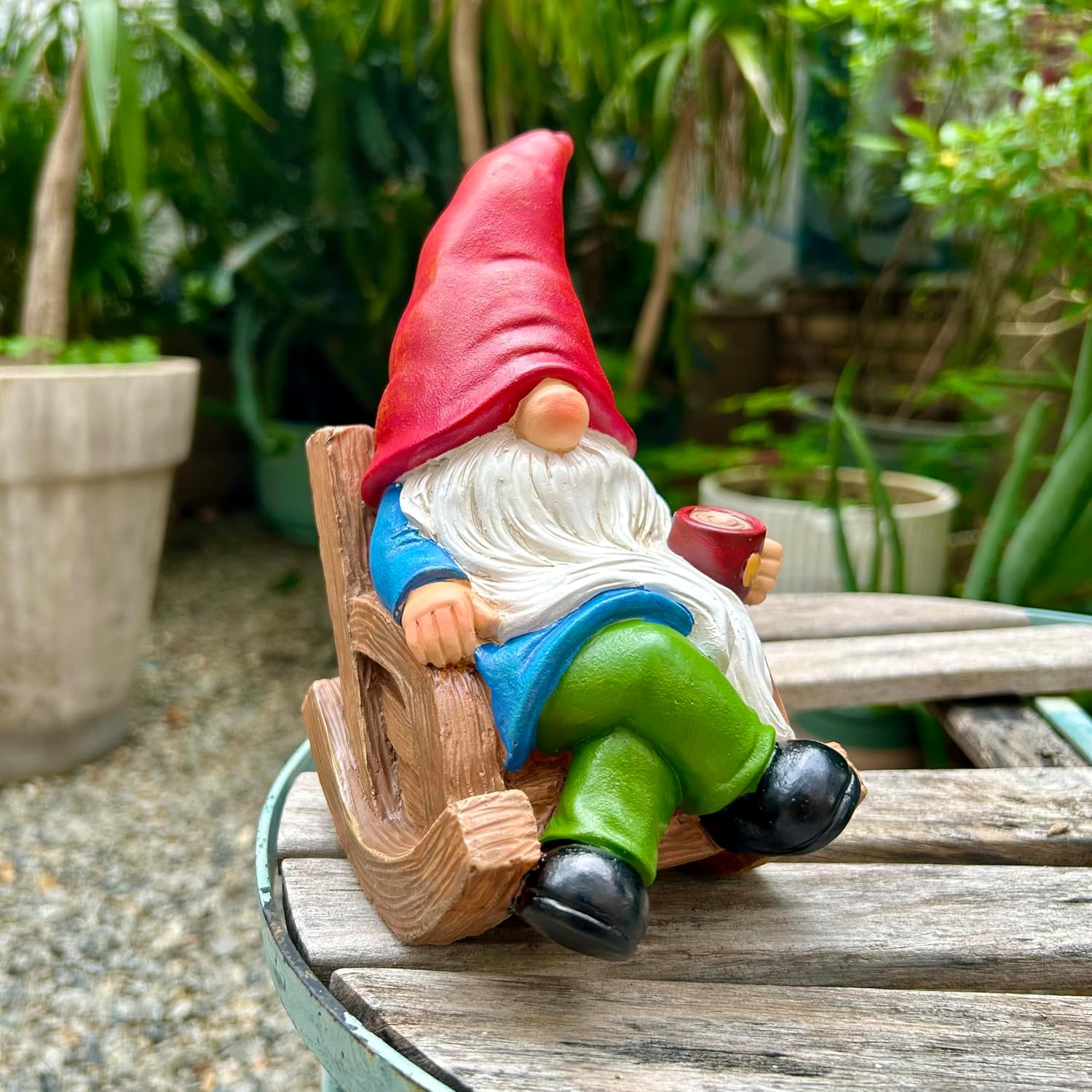 Showcases the product in a natural garden setting to demonstrate its use as outdoor decoration.