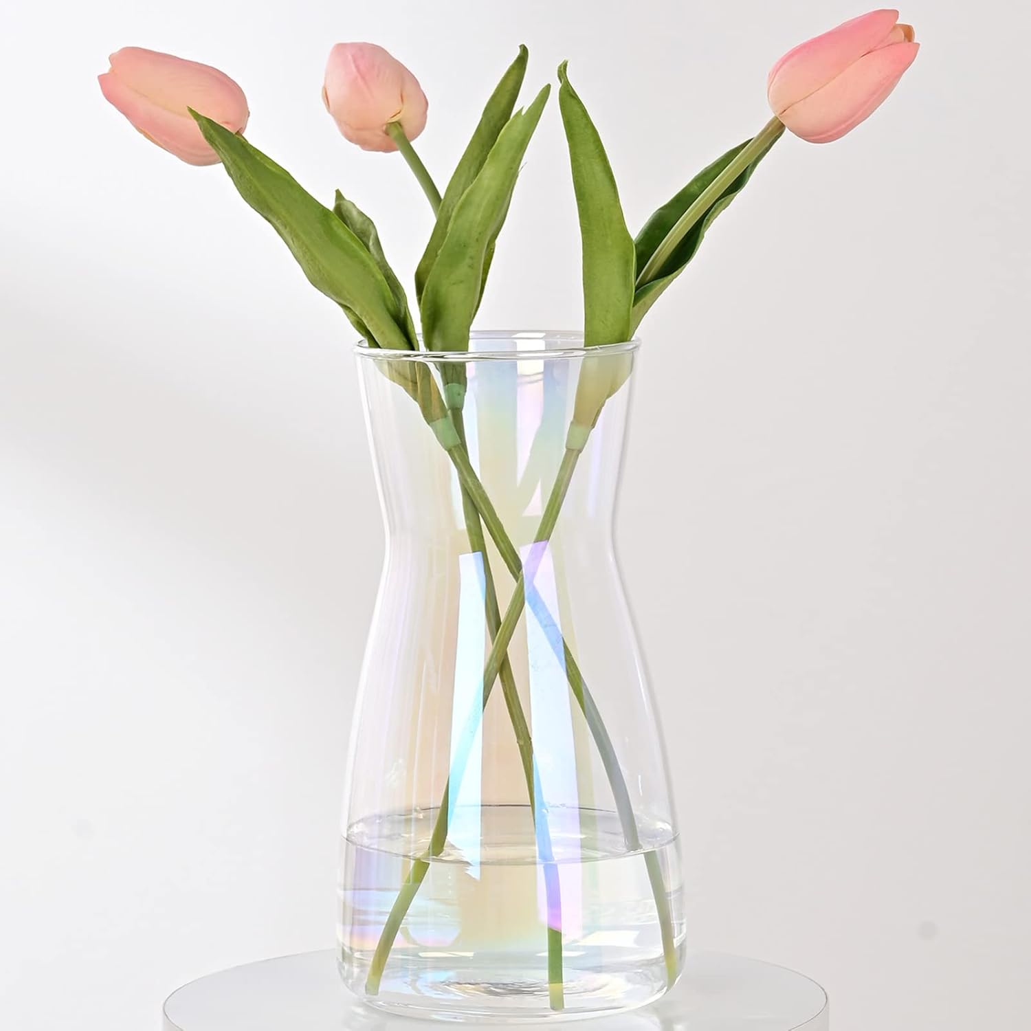 Showcases the product's elegant design and ability to display flowers beautifully. Demonstrates how the vase looks when in use, holding fresh tulips.