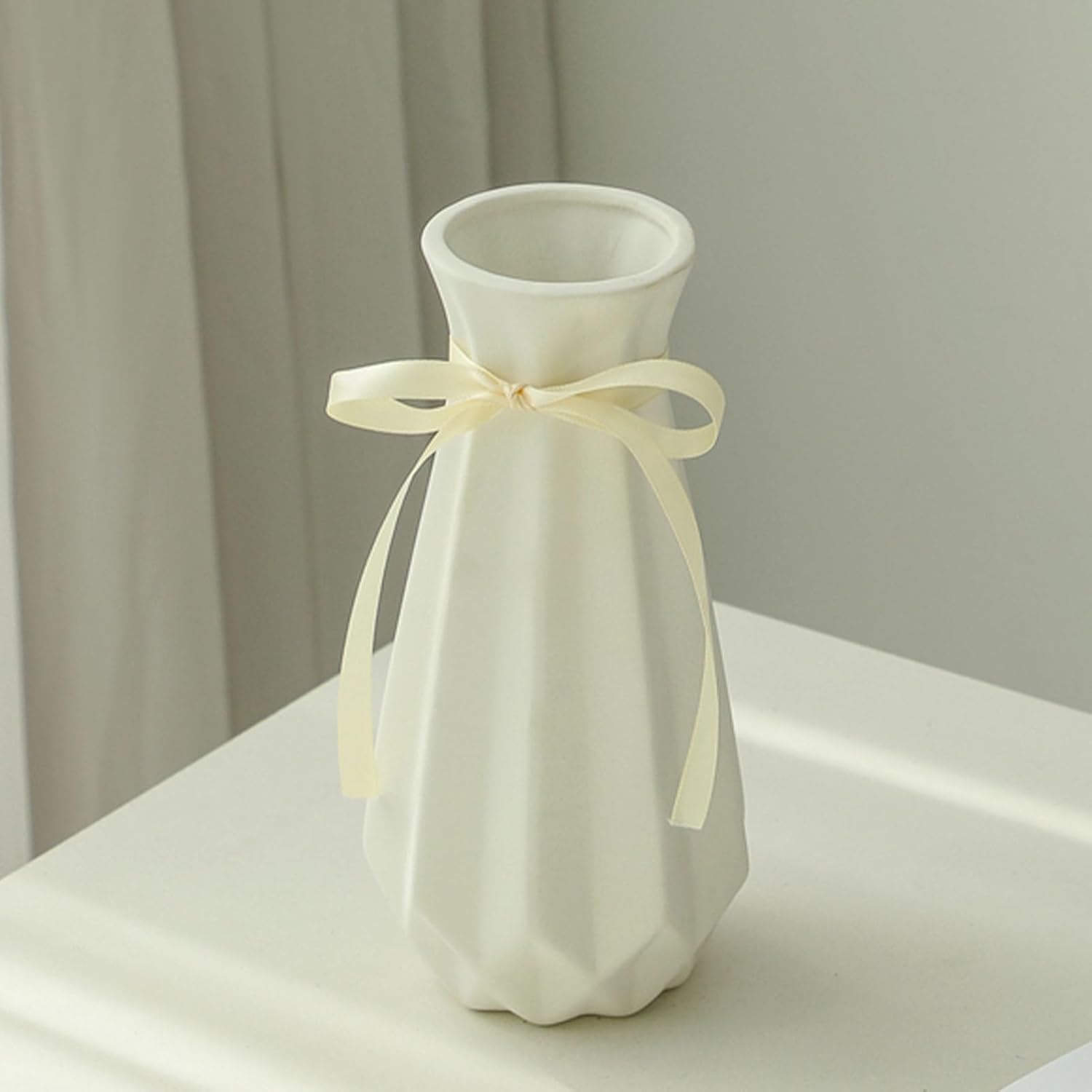 Showcases the vase as a stylish and sophisticated home decor item, emphasizing its aesthetic appeal in a real-world setting.