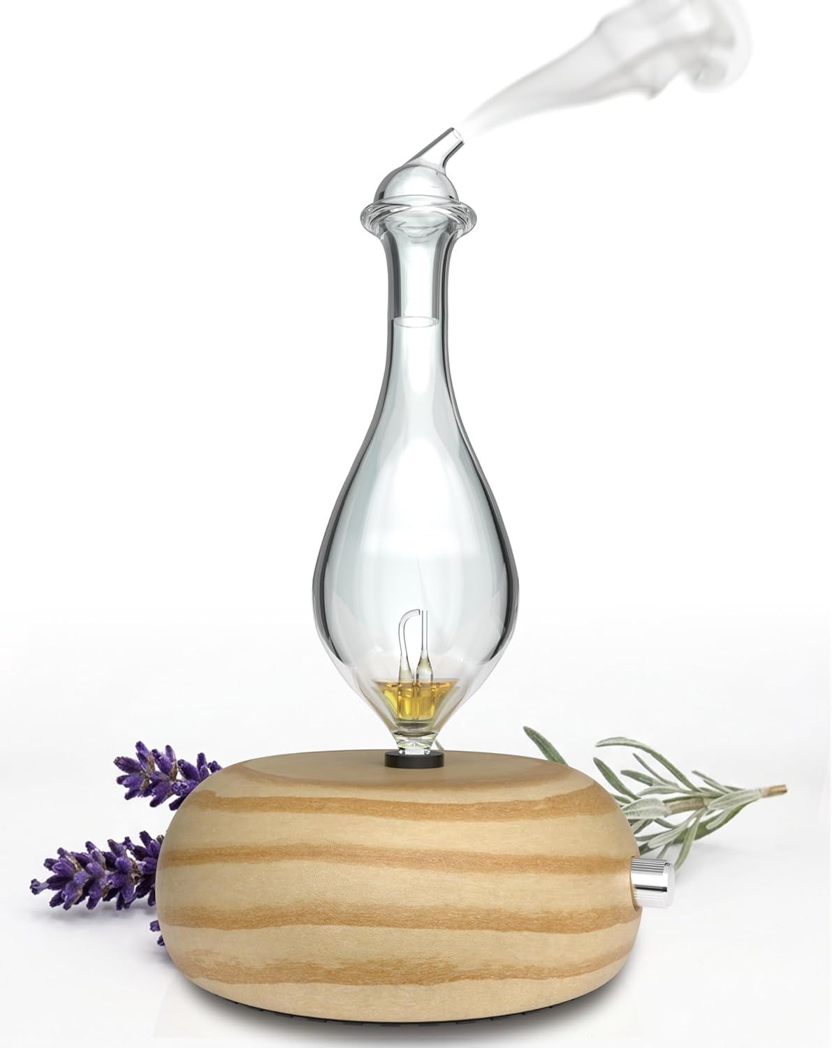 Showcases the product in a styled, real-world context with natural elements like lavender and herbs to communicate its use as an essential oil diffuser and create an appealing, calming aesthetic.