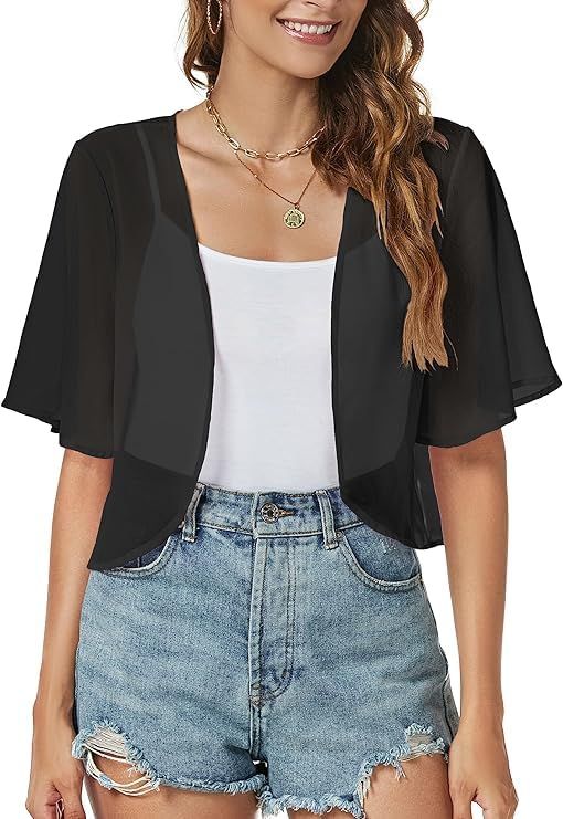 Shows how the black sheer cardigan fits and looks when worn, helping shoppers visualize the product on a person and understand its styling potential.
