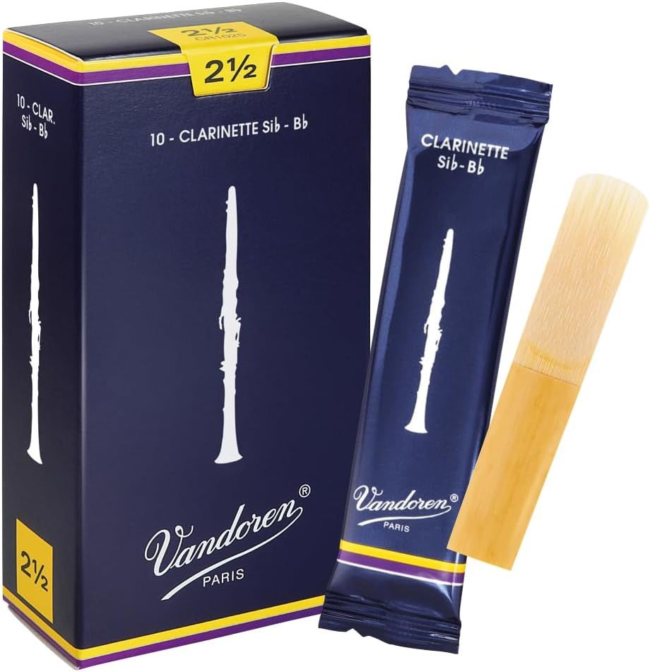 Shows the product in its branded retail packaging alongside an individual reed pouch and the clarinet reed itself to communicate professionalism, brand identity, and what buyers will receive.