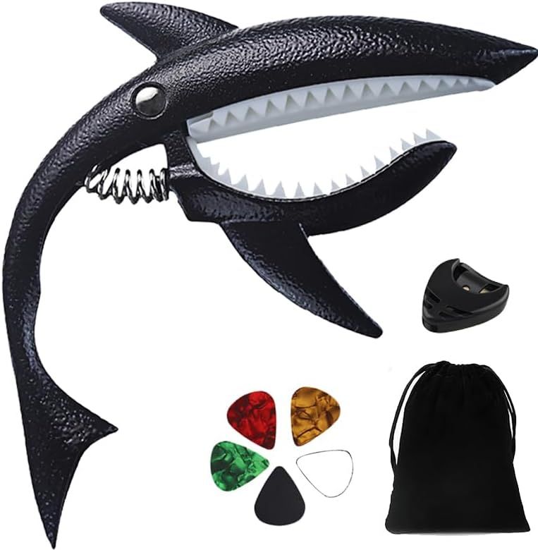 Shows the buyer exactly what is included in the purchase: the shark-shaped capo, guitar picks in multiple colors, a pick holder, and a storage pouch.