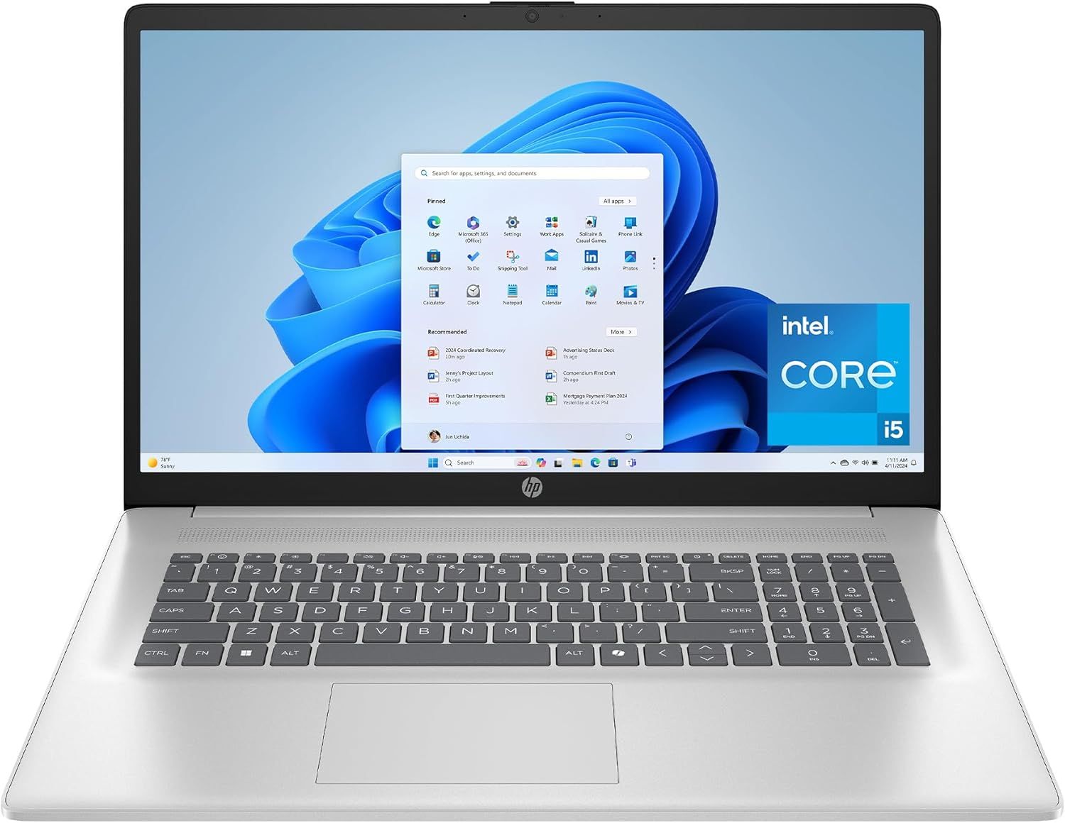 Shows the complete HP laptop with screen and keyboard visible, displaying the Windows 11 interface and highlighting the Intel Core i5 processor to communicate the product's computing power and…