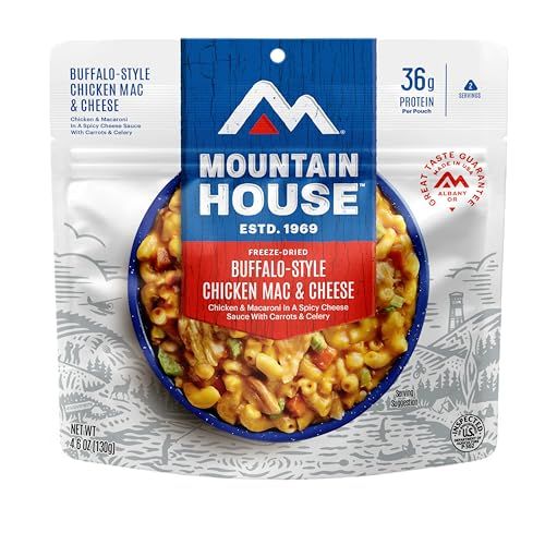 Displays the packaged freeze-dried meal product clearly, showing the food contents through the package window to communicate what the buyer receives and the meal's appetizing appearance. Shows the…