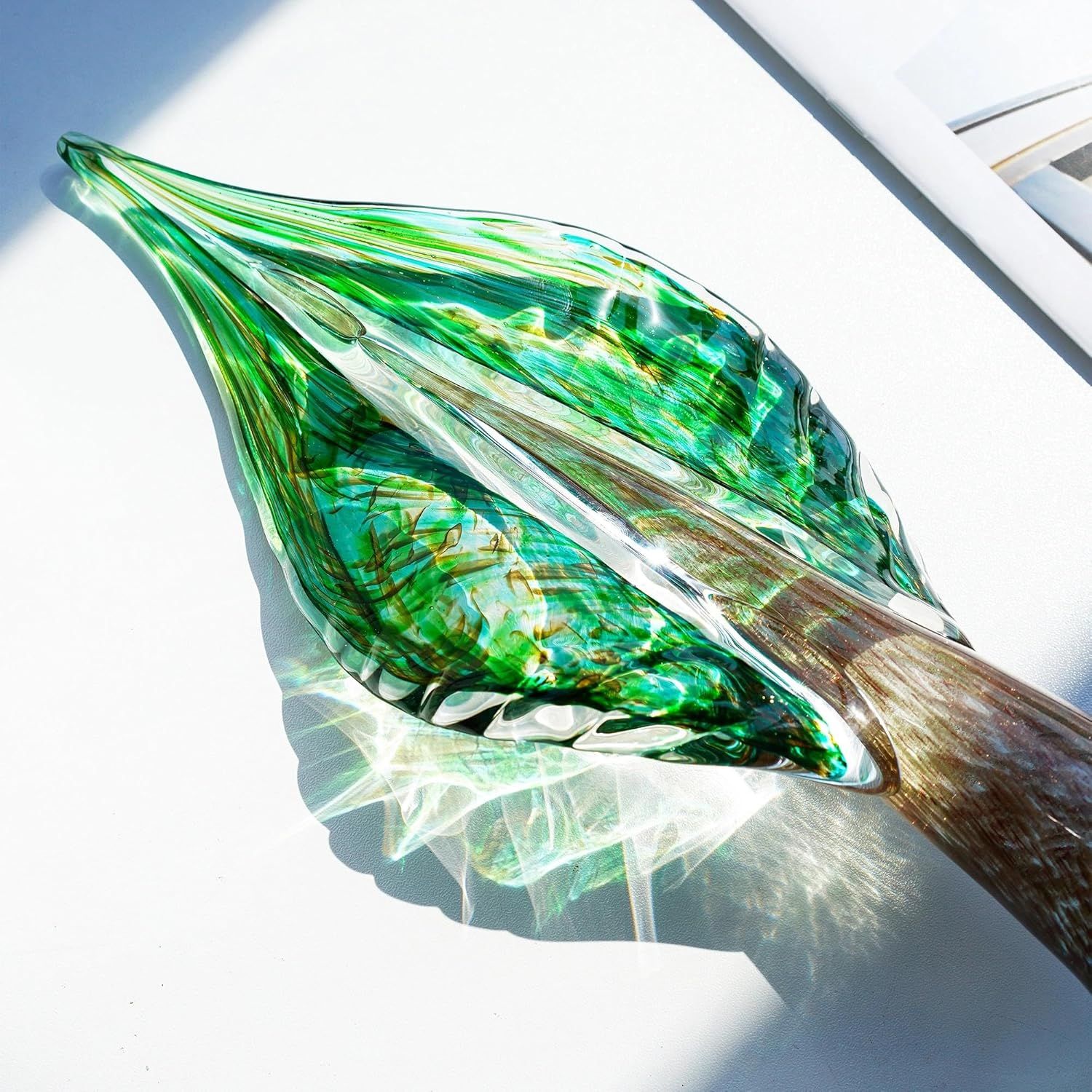 Showcases the decorative glass sculpture as the core product with clear visibility of its artistic design, colors, and craftsmanship to help shoppers appreciate its aesthetic appeal. Uses a…