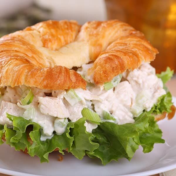 Shows the product in a real-world dining context to help shoppers visualize the meal experience and appeal of the prepared sandwich. Demonstrates how the product functions as a complete meal by…