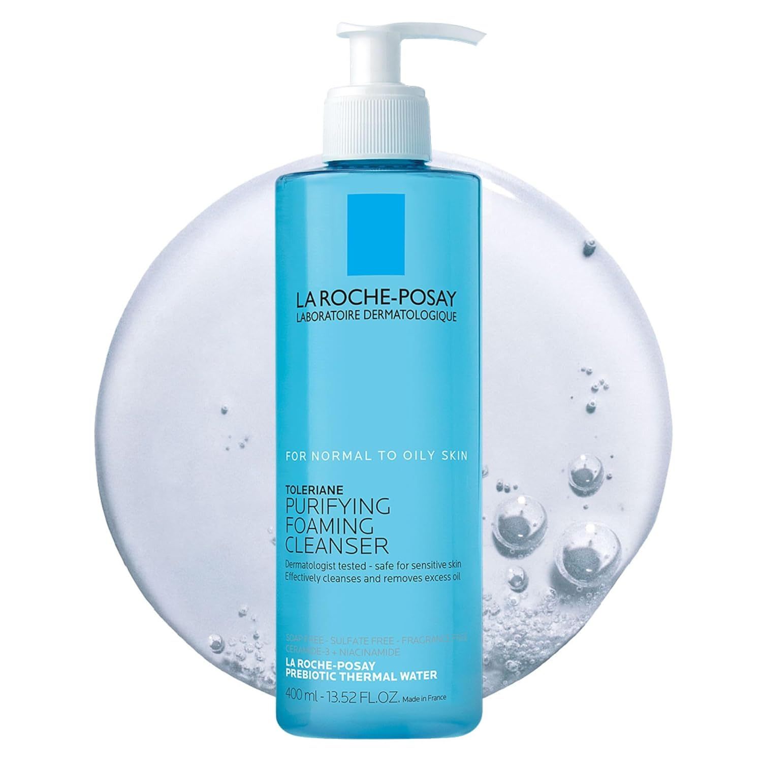 Displays the La Roche-Posay cleanser bottle clearly to show the product packaging, branding, and key product claims for normal to oily skin. Uses decorative water bubbles and a circular background…