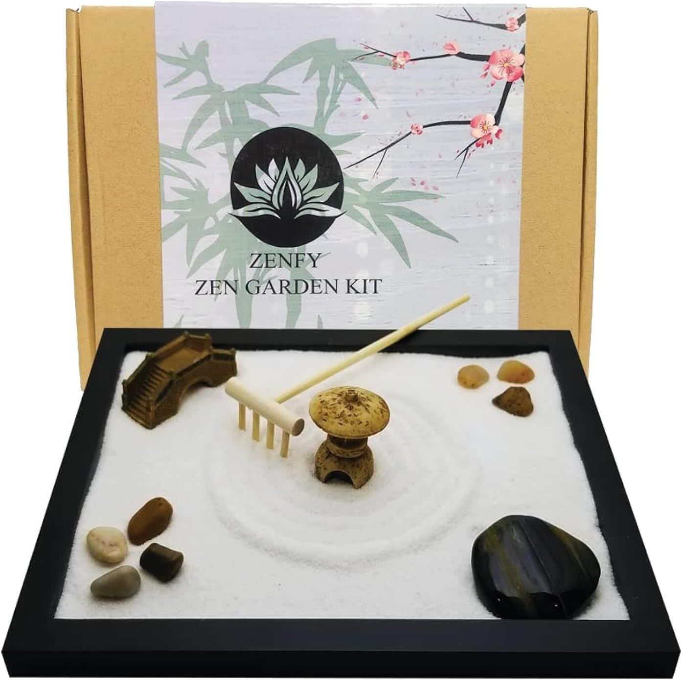 Shows the complete zen garden kit with all included components (tray, sand, rake, stones, pagoda, bridge) to communicate the full value and contents of the purchase. Displays the decorative retail…