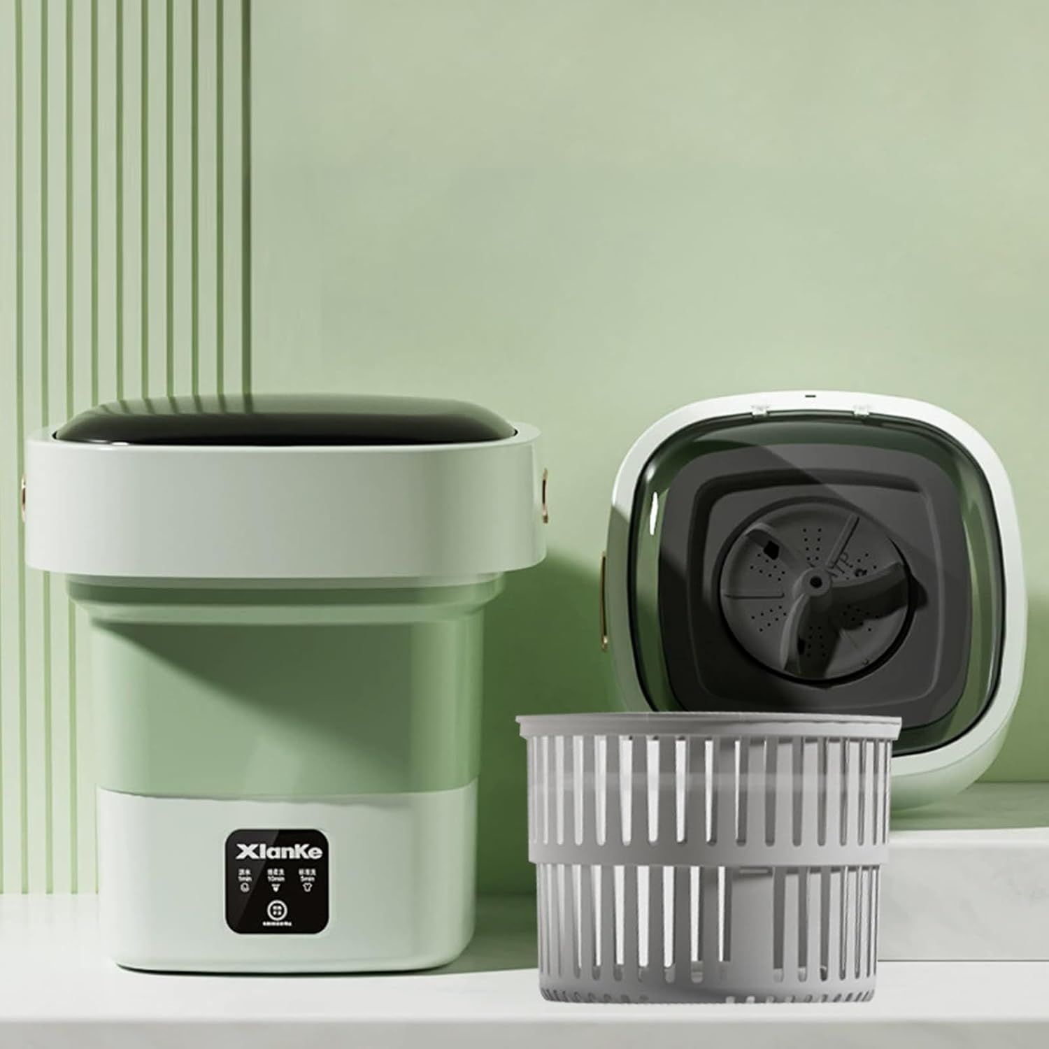 Displays the core product, a compact portable washing machine with its basket accessory, showing its clean modern design and space-saving form factor to appeal to shoppers looking for convenient…
