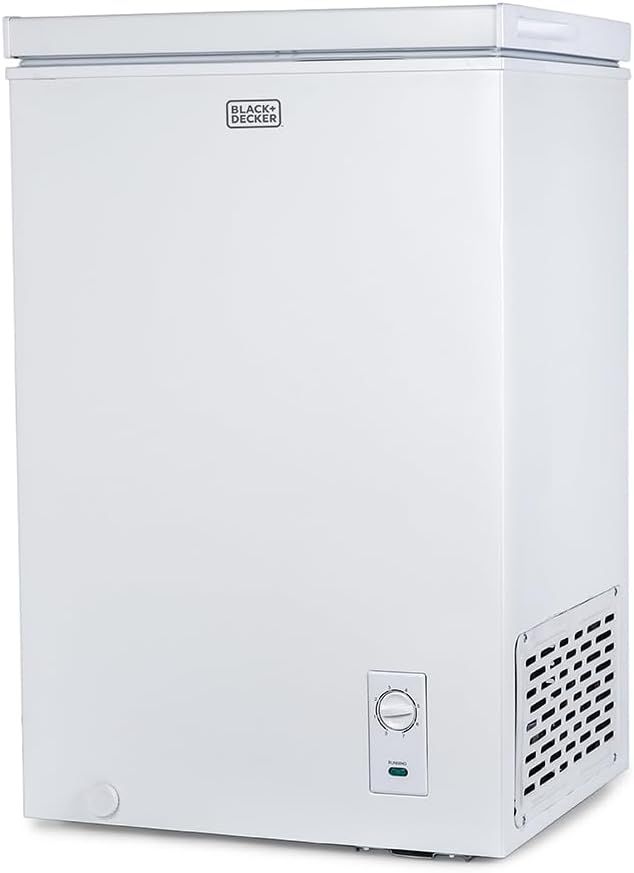 Displays the BLACK+DECKER chest freezer clearly on a white background to show the product's design, brand, and key features like the control dial and ventilation grille.