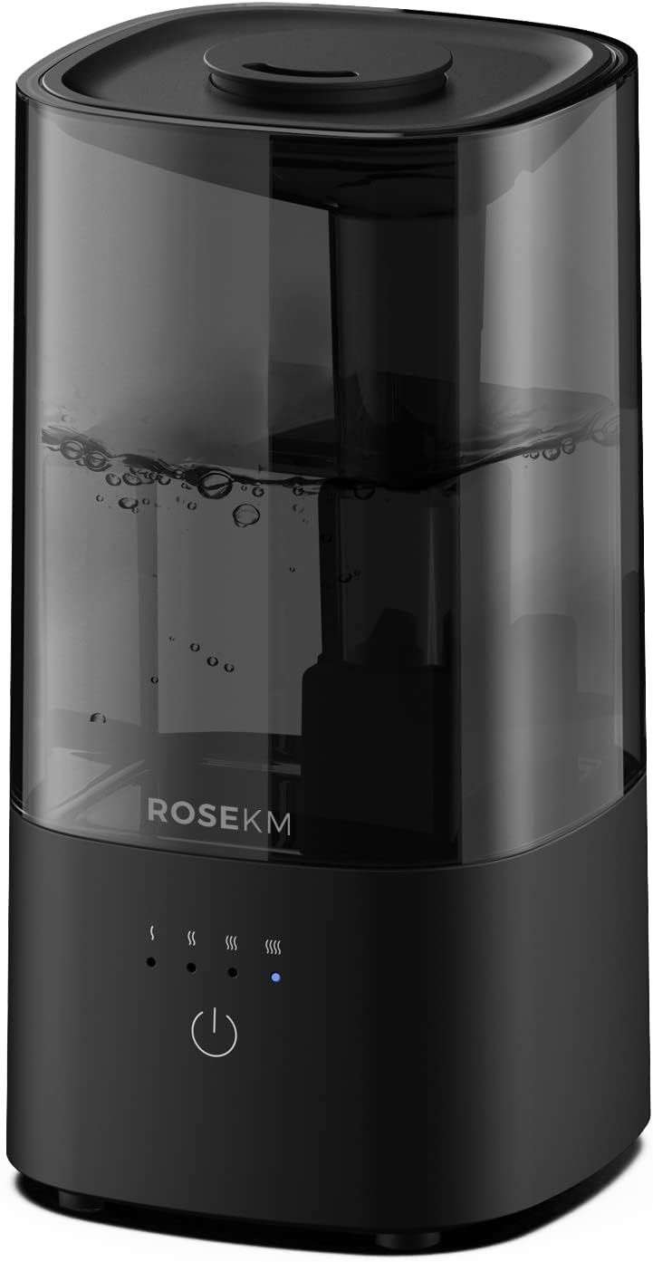Shows the humidifier with its transparent water reservoir and visible water level to communicate capacity and ease of monitoring. The control panel with mist level indicators reassures shoppers…