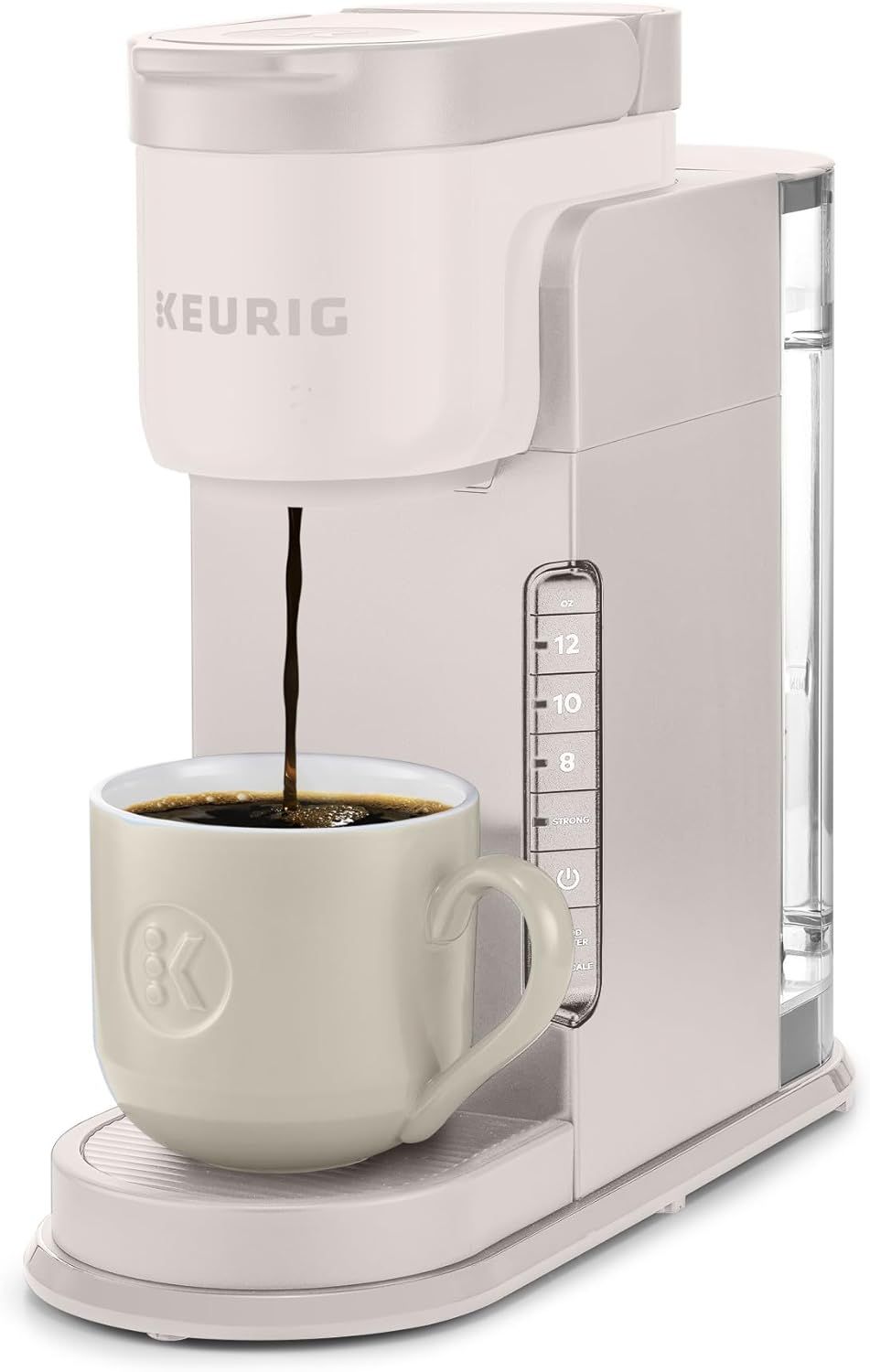 Shows the Keurig coffee maker actively brewing coffee into a cup, demonstrating how the product works and what it does to help shoppers visualize the brewing process and end result. Displays the…