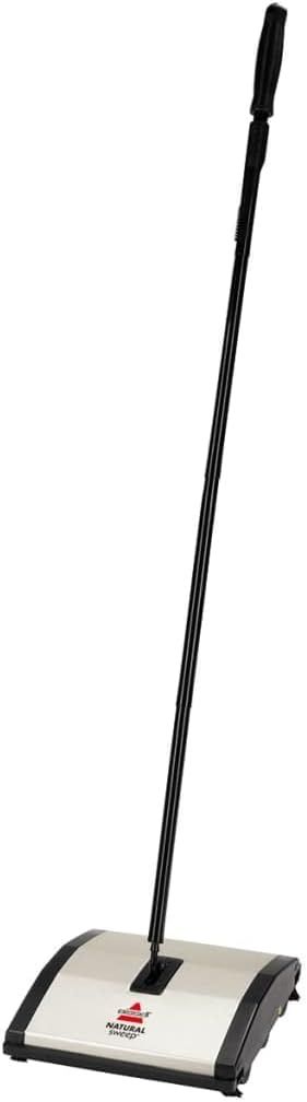 Shows the core product clearly on a white background to help shoppers understand what they are purchasing - a manual floor sweeper with an extended handle.