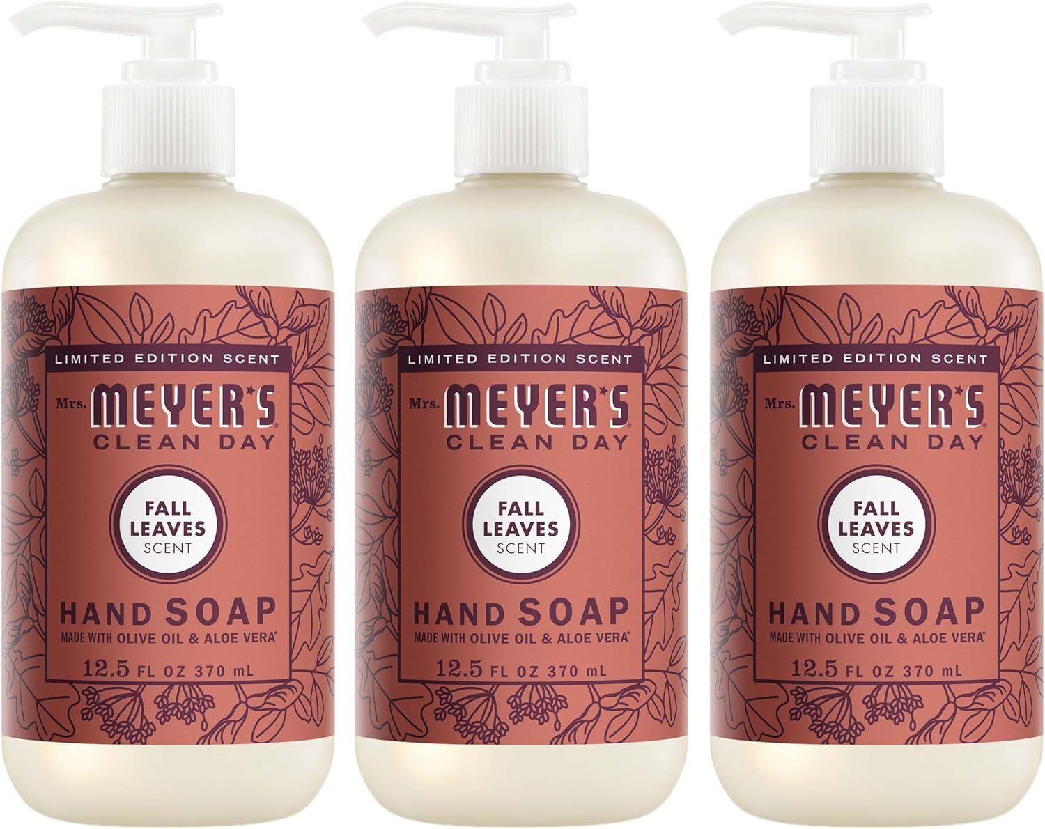 Shows three bottles of the hand soap product to communicate that this is a multi-pack purchase, clearly displaying the Fall Leaves scent variant and Mrs. Meyer's Clean Day branding. Displays the…