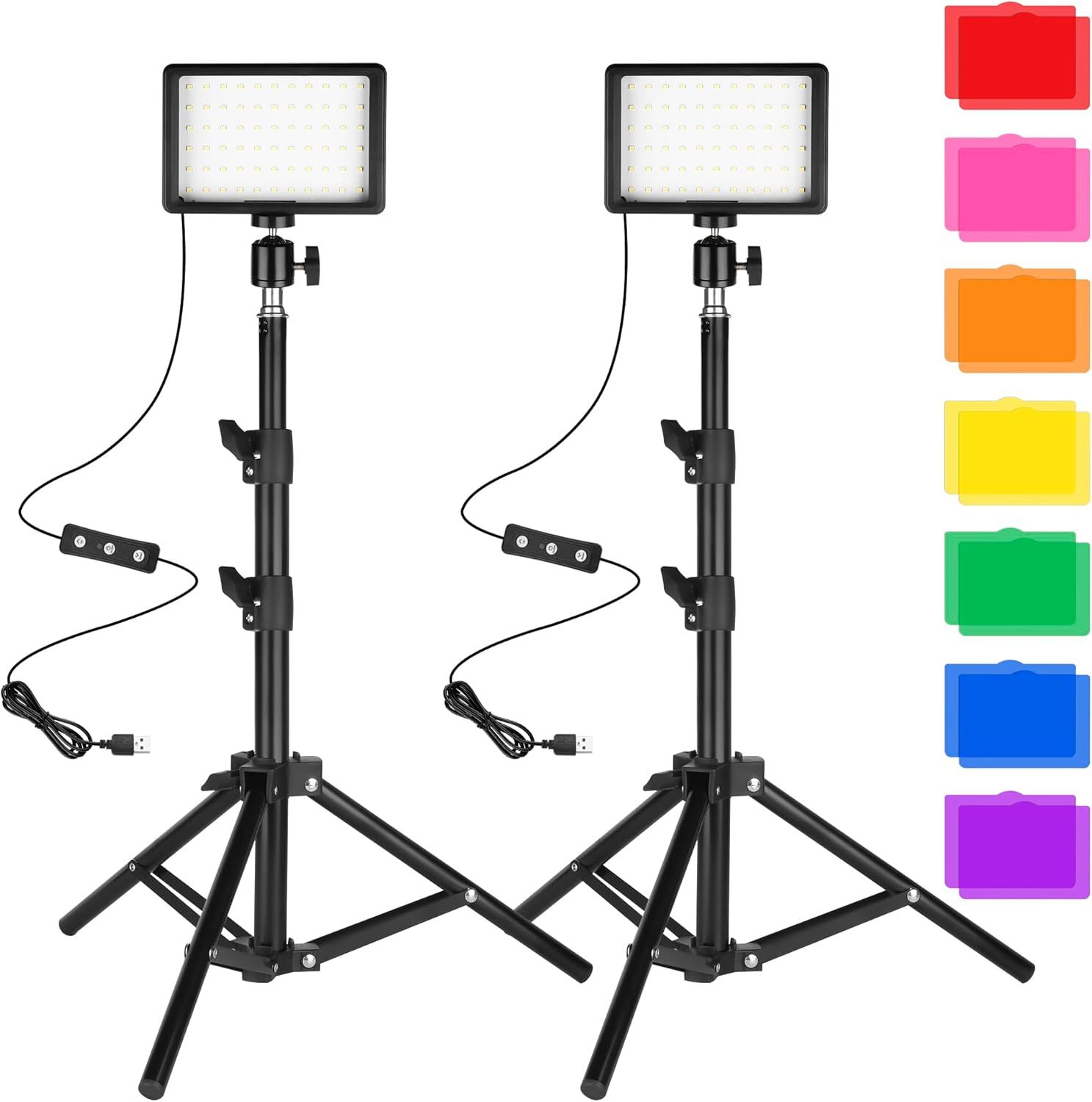 Shows the complete lighting kit including two LED panel lights on adjustable tripod stands with control units and colorful filter accessories, communicating the full setup and versatility of the…
