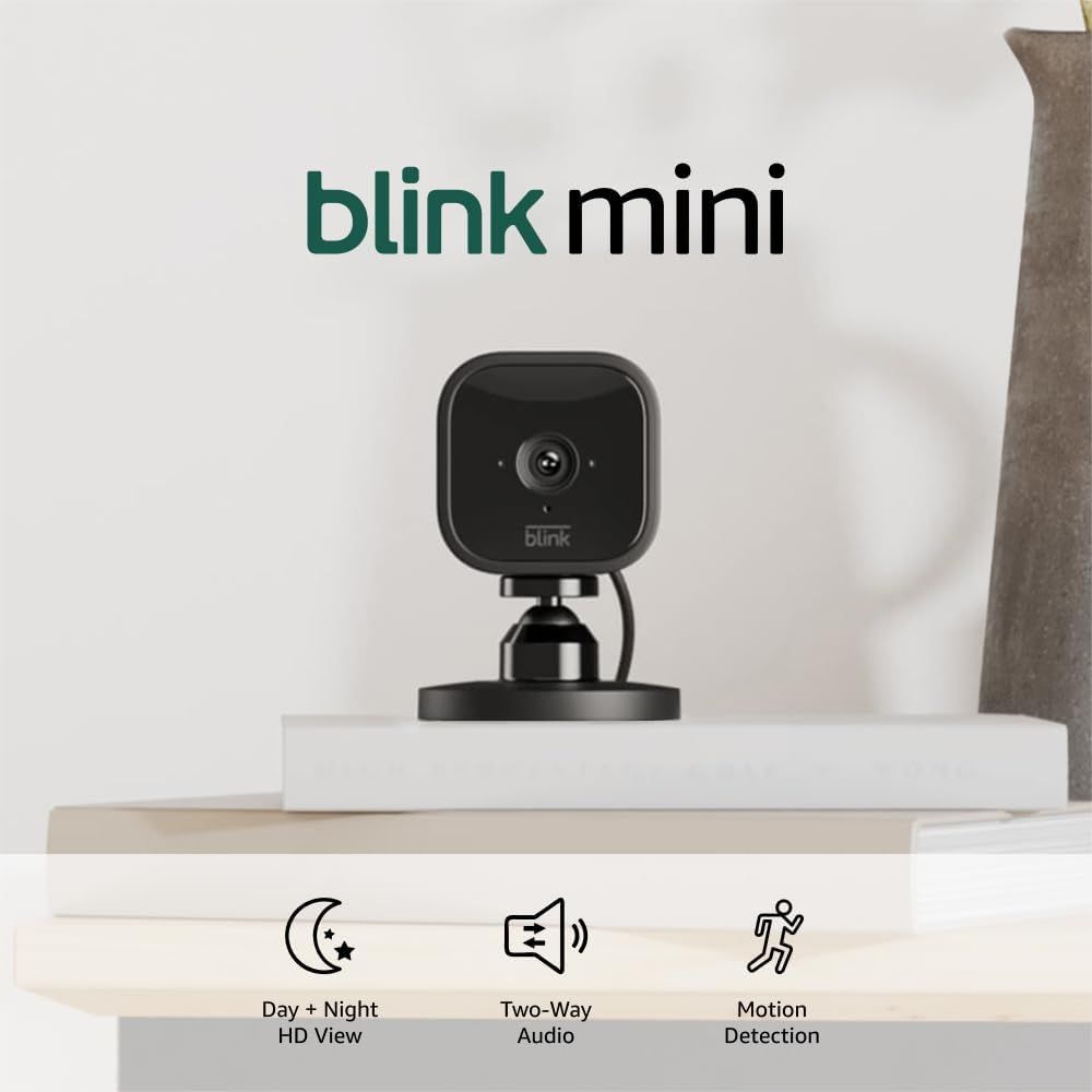 Shows the Blink Mini security camera in a lifestyle setting to help shoppers visualize its size and placement in their home. Demonstrates the camera in a real home environment on a shelf to show how…