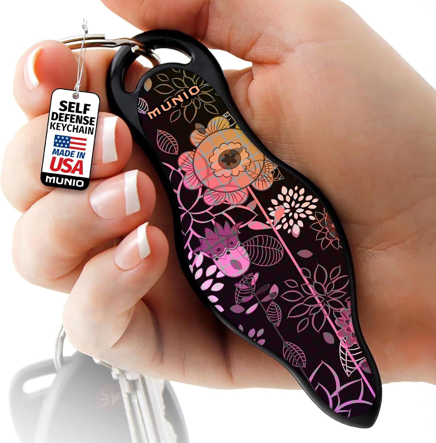 Shows a person holding the self-defense keychain to demonstrate scale, grip comfort, and how it fits naturally in the hand for real-world use. Displays the product tag with Made in USA branding to…