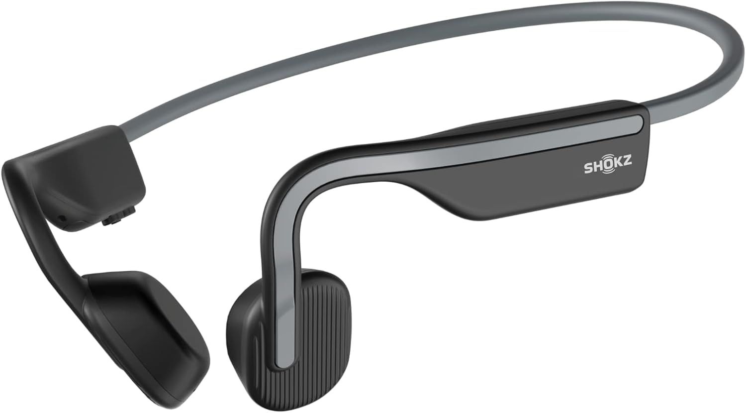 Displays the core product clearly on a white background to show the unique bone conduction headphone design and build quality. Uses a subtle drop shadow to ground the product and give it visual…
