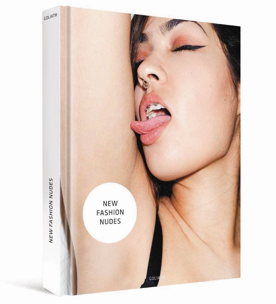 Shows the physical retail packaging (book/box) the buyer will receive, establishing the product format and brand identity with the GOLIATH branding and NEW FASHION NUDES title clearly visible.