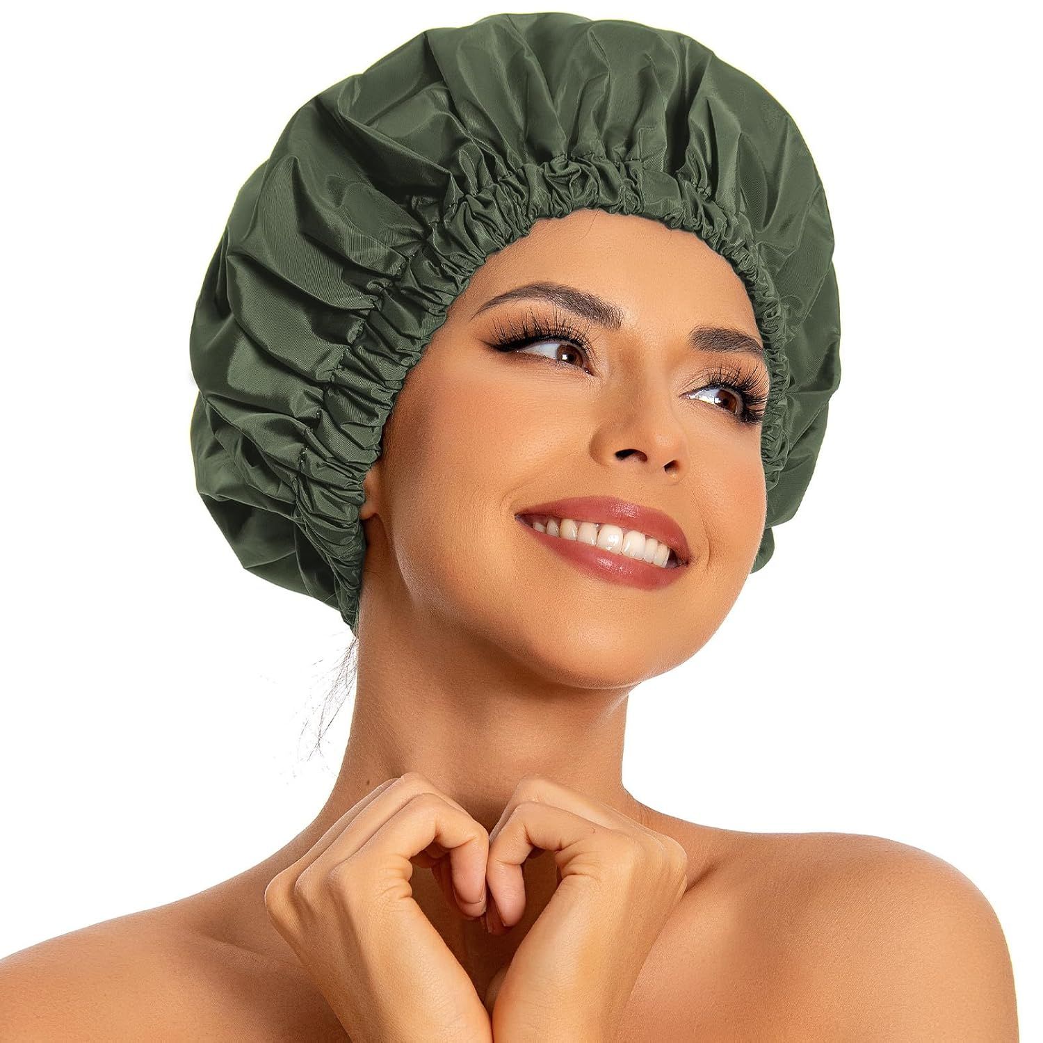 Shows the core product (a green shower cap) being worn by a model to demonstrate fit, size, and how it looks when in use. Uses a human model to provide scale, fit context, and demonstrate how the…