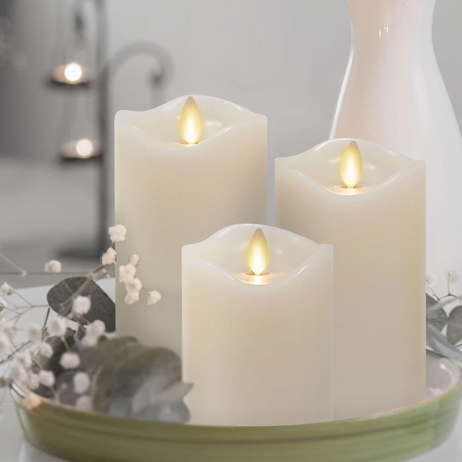 Shows the candles in a styled home environment to help shoppers visualize how the product will look in their own living space and create ambiance. Demonstrates the candles actively lit with…