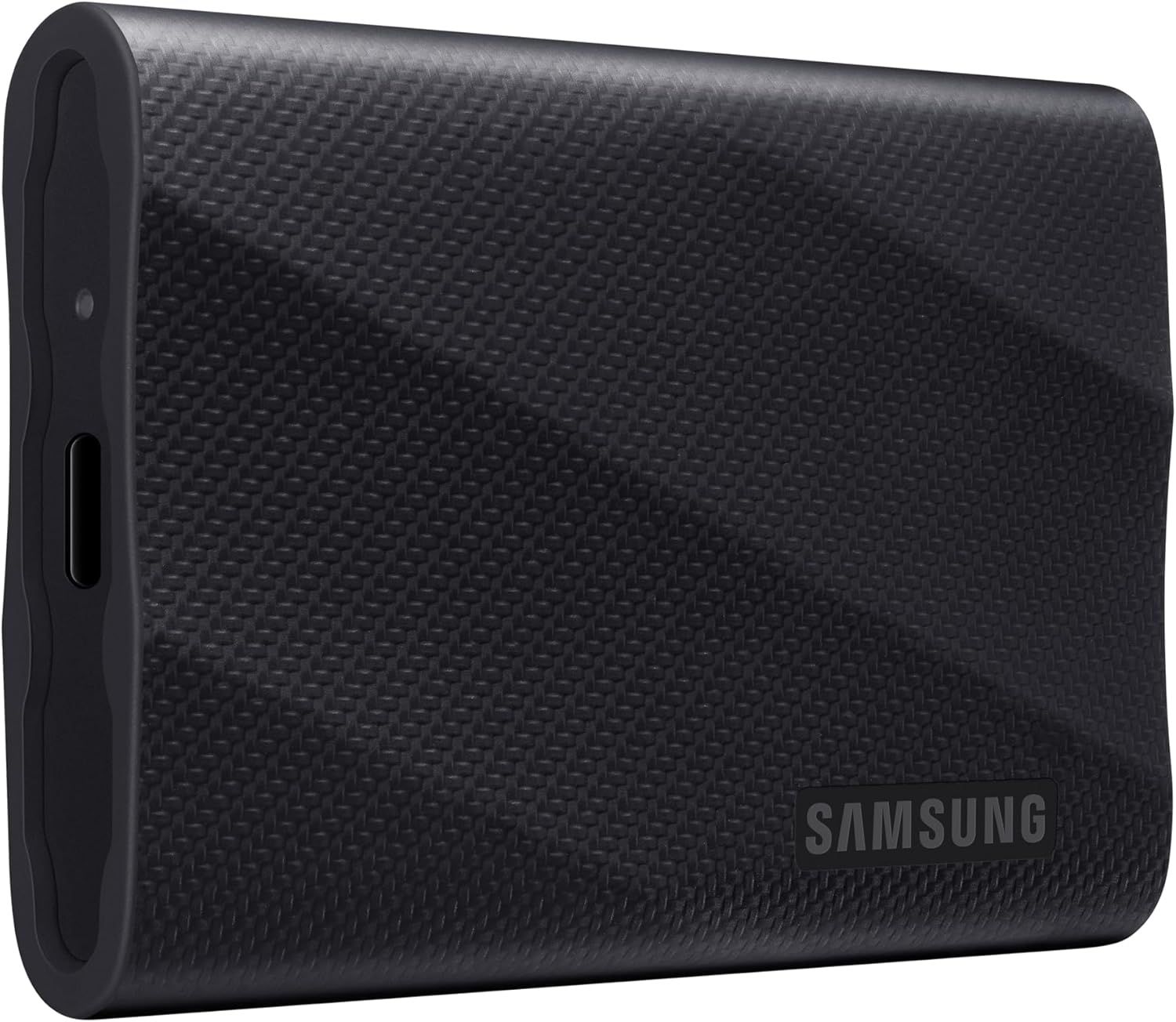 Displays the Samsung portable SSD with its textured carbon fiber finish to communicate premium build quality and portability for shoppers seeking reliable external storage.