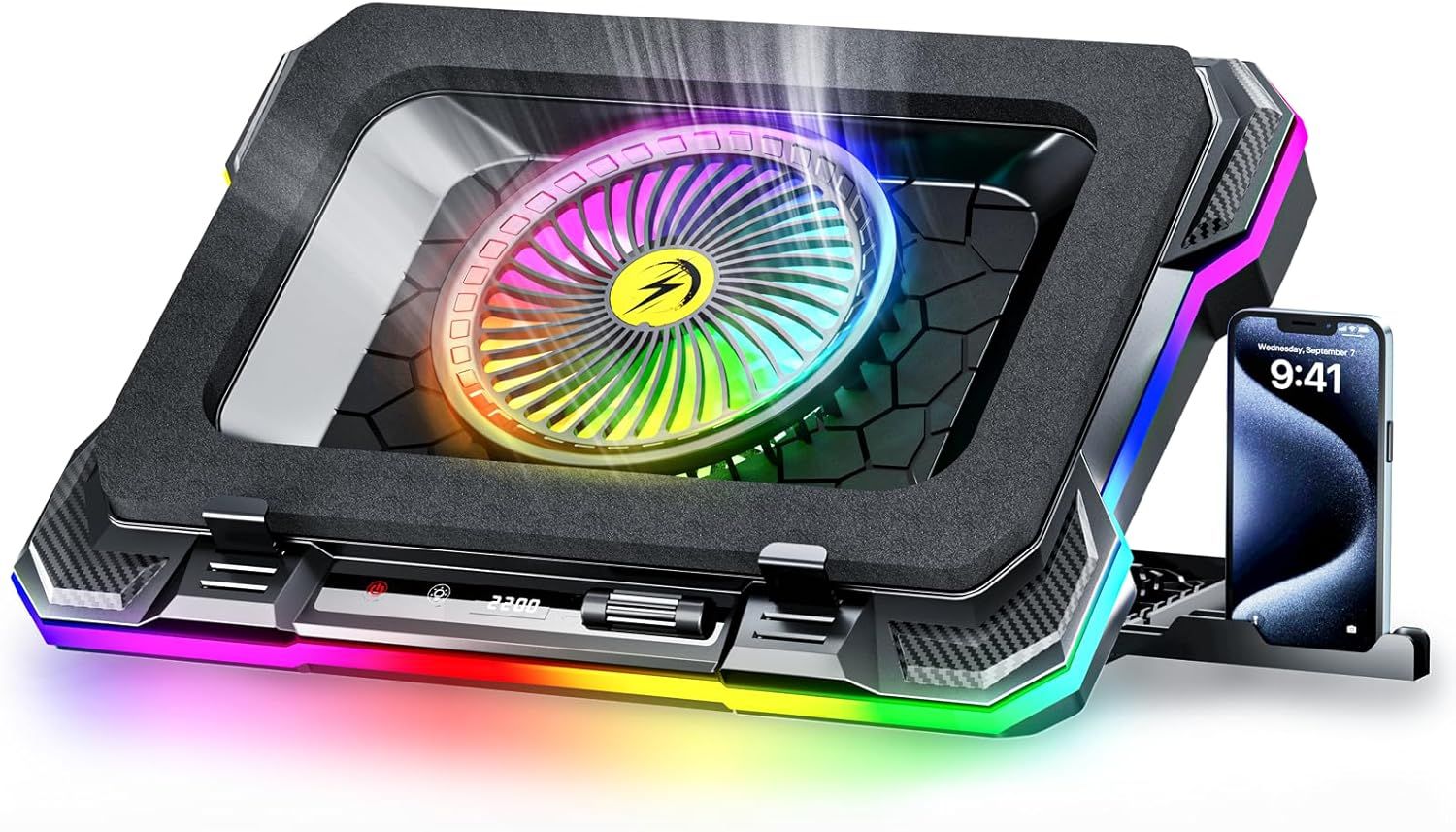 Showcases the laptop cooling pad with its prominent RGB-lit fan and integrated phone stand to communicate its gaming aesthetic and multi-functional design. Uses vibrant RGB lighting reflection…