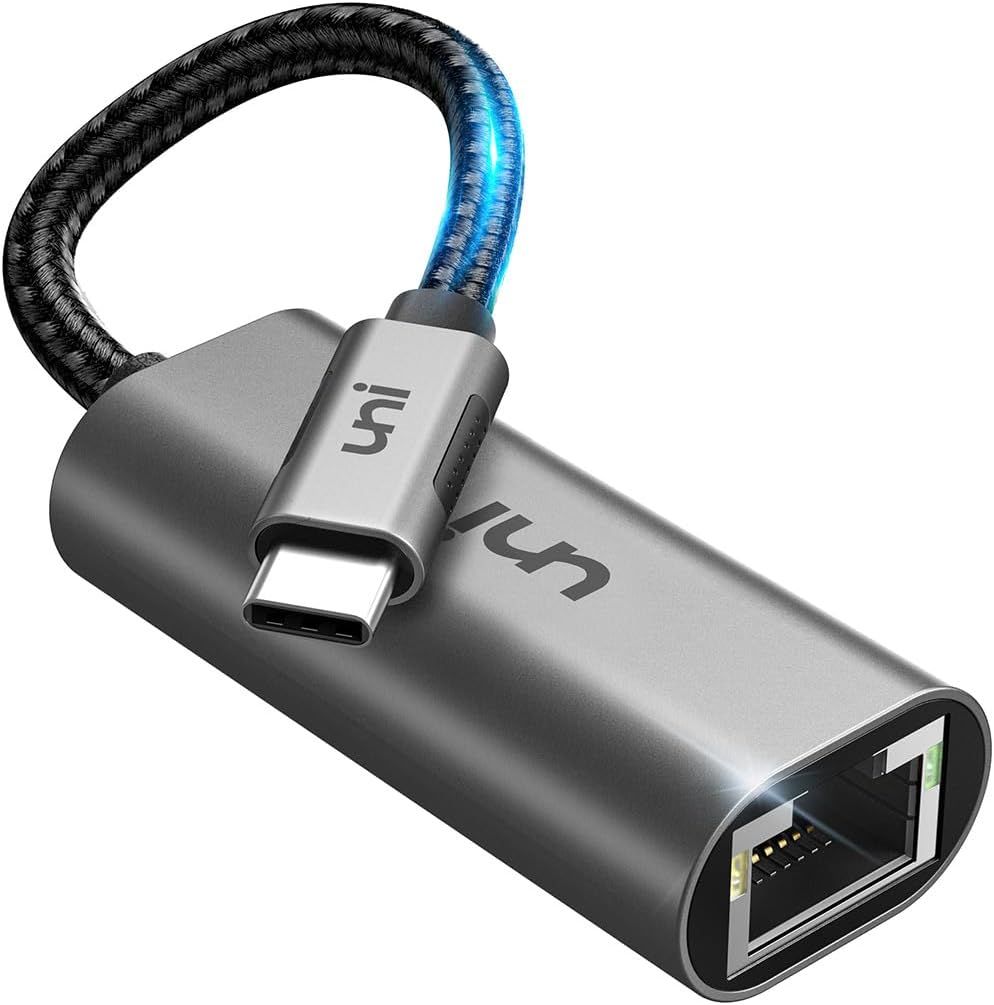 Shows the core product clearly on a white background to communicate what the buyer will receive: a USB-C to Ethernet adapter with a durable braided cable and metal housing. Uses a subtle drop shadow…