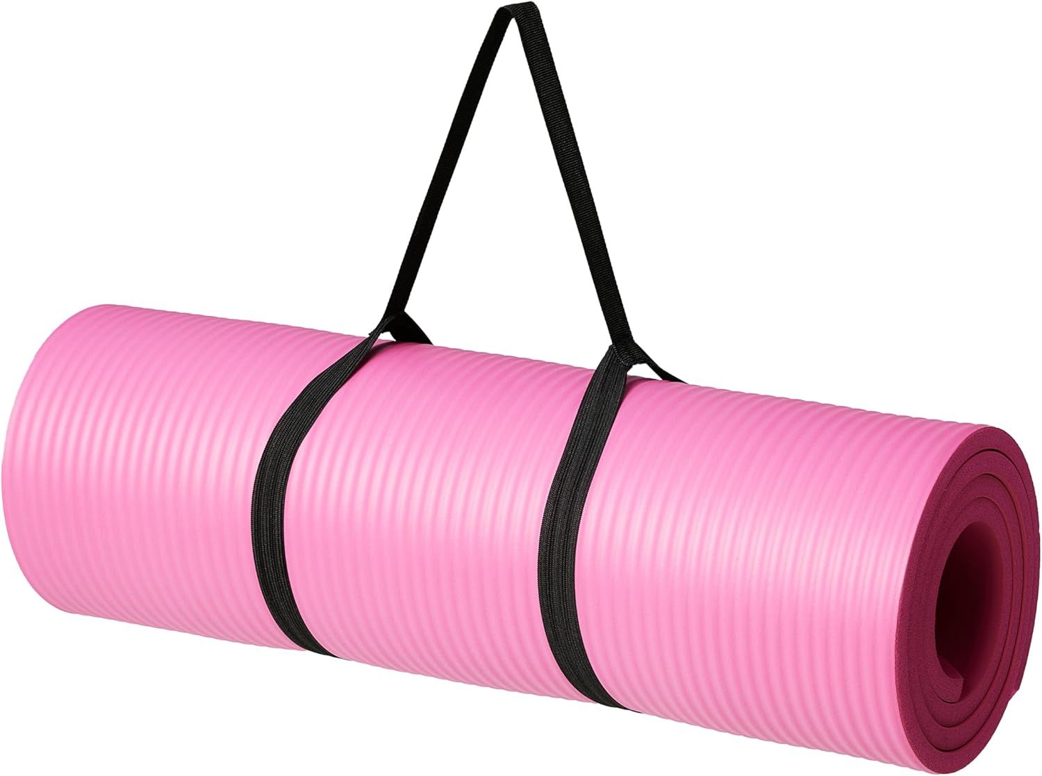 Shows the core product clearly on a white background to communicate what the shopper is purchasing: a pink yoga mat with an included black carrying strap for portability. Demonstrates that the…