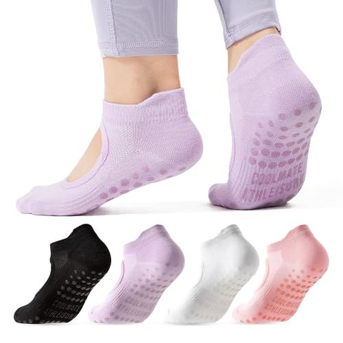 Shows a person wearing the yoga/grip socks to demonstrate fit, comfort, and the non-slip grip feature on the sole, helping shoppers visualize how the product looks and functions when worn. Displays…