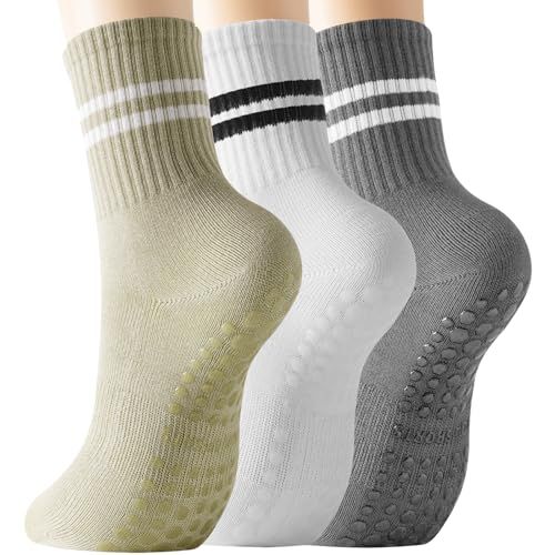 Displays three pairs of athletic socks in different colors with stripe details and non-slip grip on the sole, showing shoppers the variety and functional features included in the multi-pack. Uses…