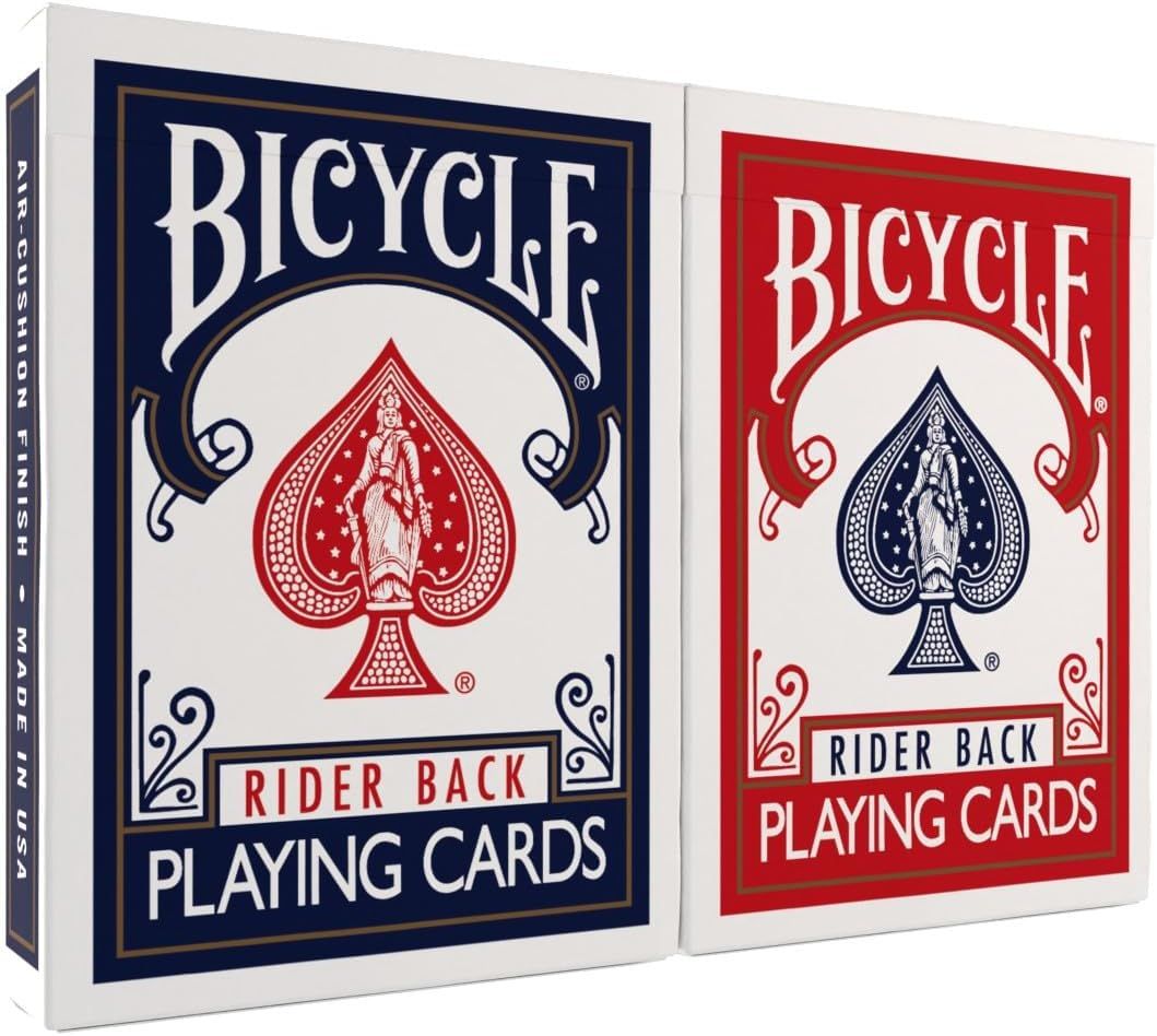 Shows the physical retail packaging boxes for Bicycle playing cards in two color variants (blue and red) to communicate what the shopper will receive and the available color options. Displays the…