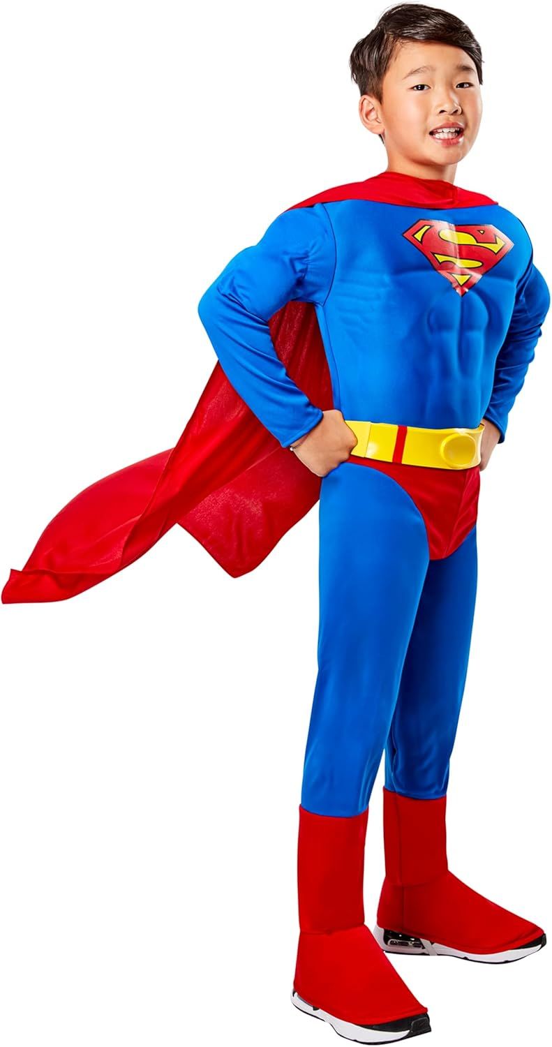 Shows the complete Superman costume on a child model to demonstrate fit, appearance, and included cape accessory, helping parents visualize how the costume looks when worn. Uses a child model in a…