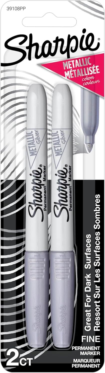 Displays the core product—two metallic silver Sharpie permanent markers—clearly visible in retail packaging so shoppers can see exactly what they are purchasing. Shows the physical retail packaging…