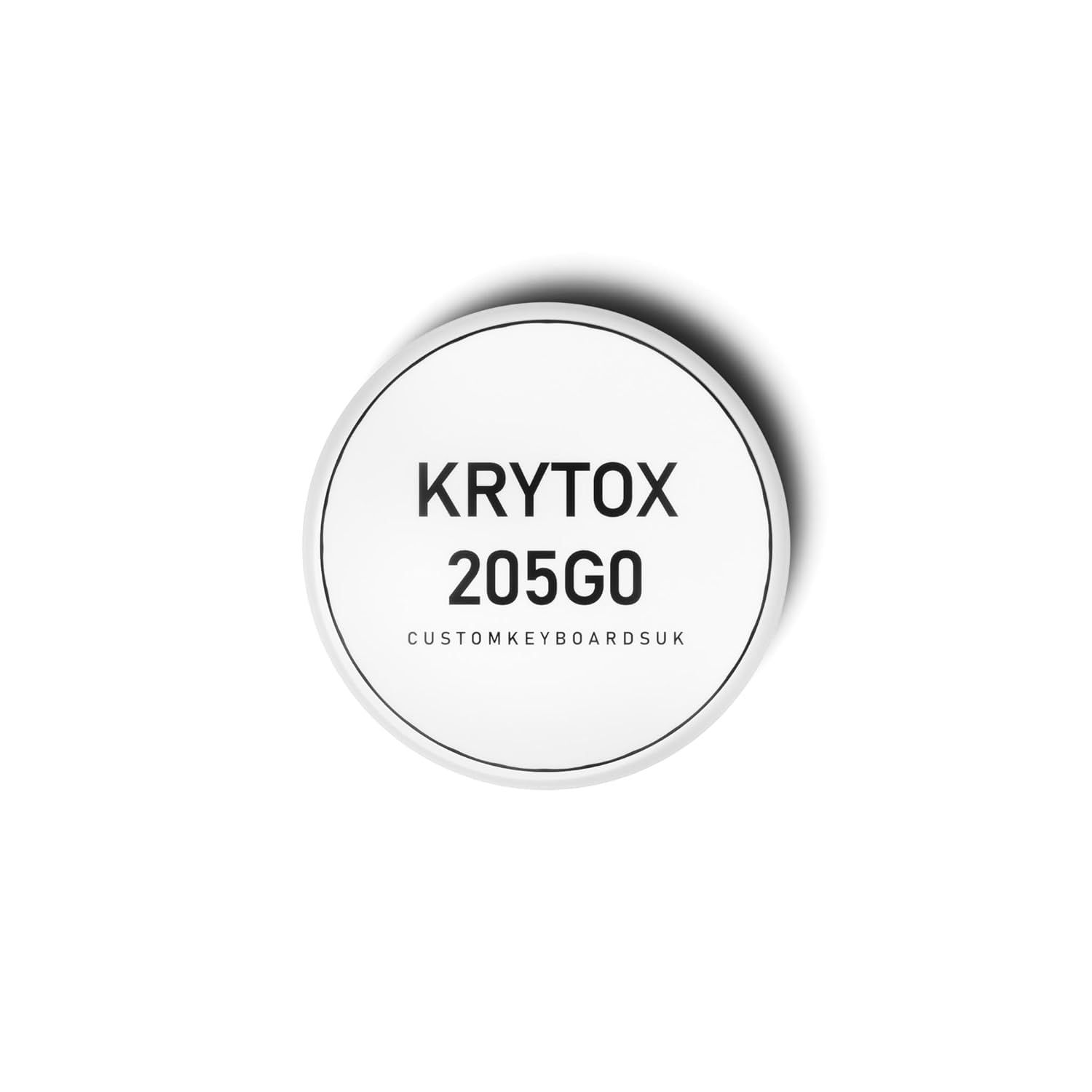 Displays the core product, a circular label or sticker with the Krytox 205G0 branding and model number, clearly showing what the buyer will receive. Uses a drop shadow beneath the circular product…