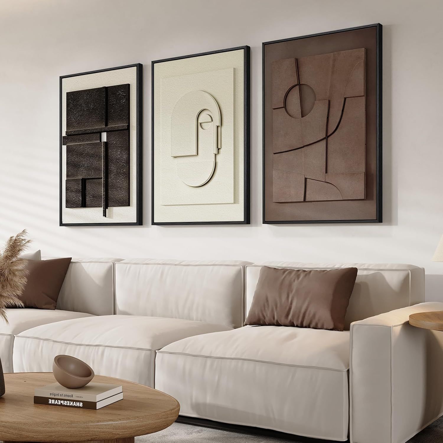 Shows the framed art pieces displayed in a real living room environment to help shoppers visualize how the product will look in their own home and understand the scale and aesthetic appeal. Displays…