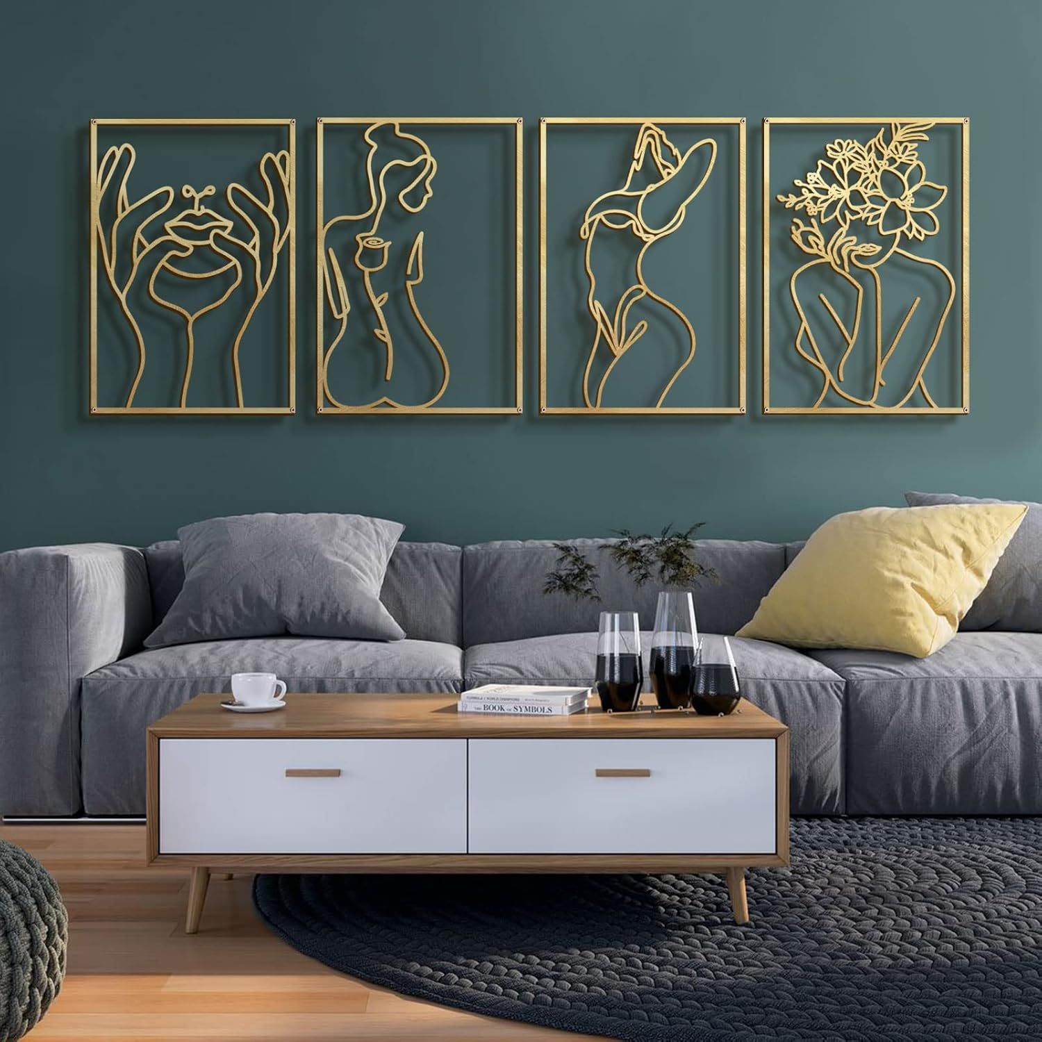Shows the core product—a set of four decorative wall art panels with abstract line art figures—displayed in a lifestyle setting to help shoppers visualize the product's aesthetic and scale in a home…