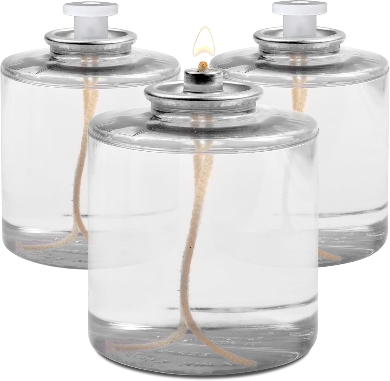 Shows the core product—a set of three clear glass oil lamps with metal lids and wicks—to communicate what the buyer will receive and demonstrate the product's clean, functional design. Demonstrates…