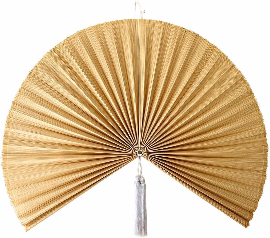 Displays the core product—a decorative bamboo or palm leaf fan—in its fully opened state to showcase its natural material, radial pleated structure, and elegant design for home decor.