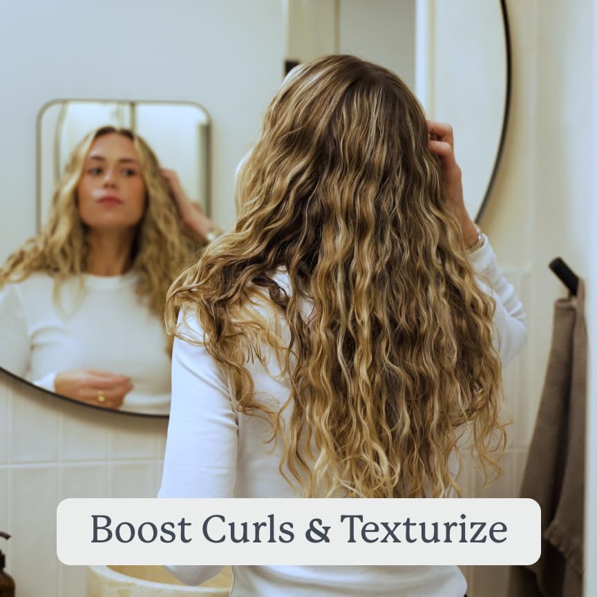 Highlights the product's ability to enhance and define curls while adding texture and volume to hair.
