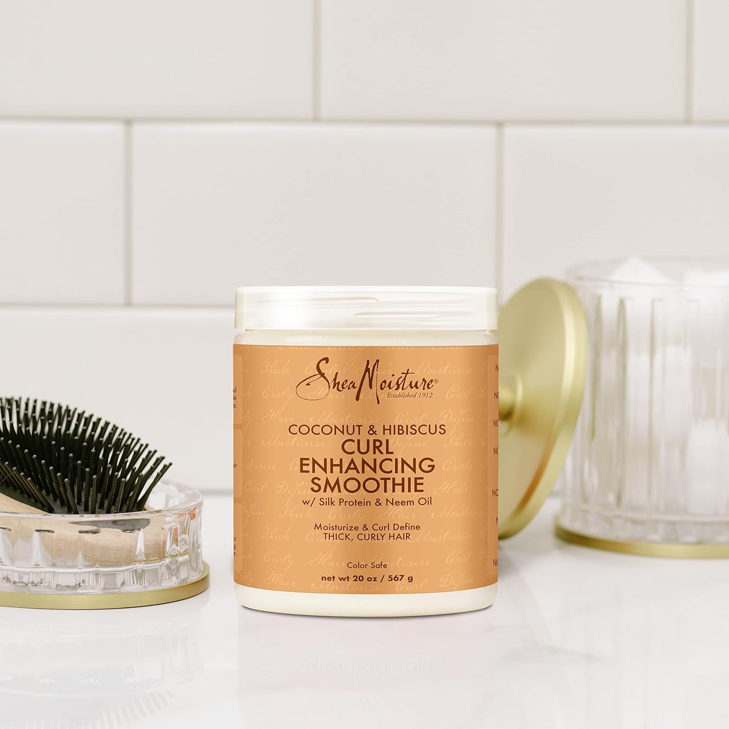 Highlights the product's ability to enhance and define curls while providing moisturization for thick, curly hair.