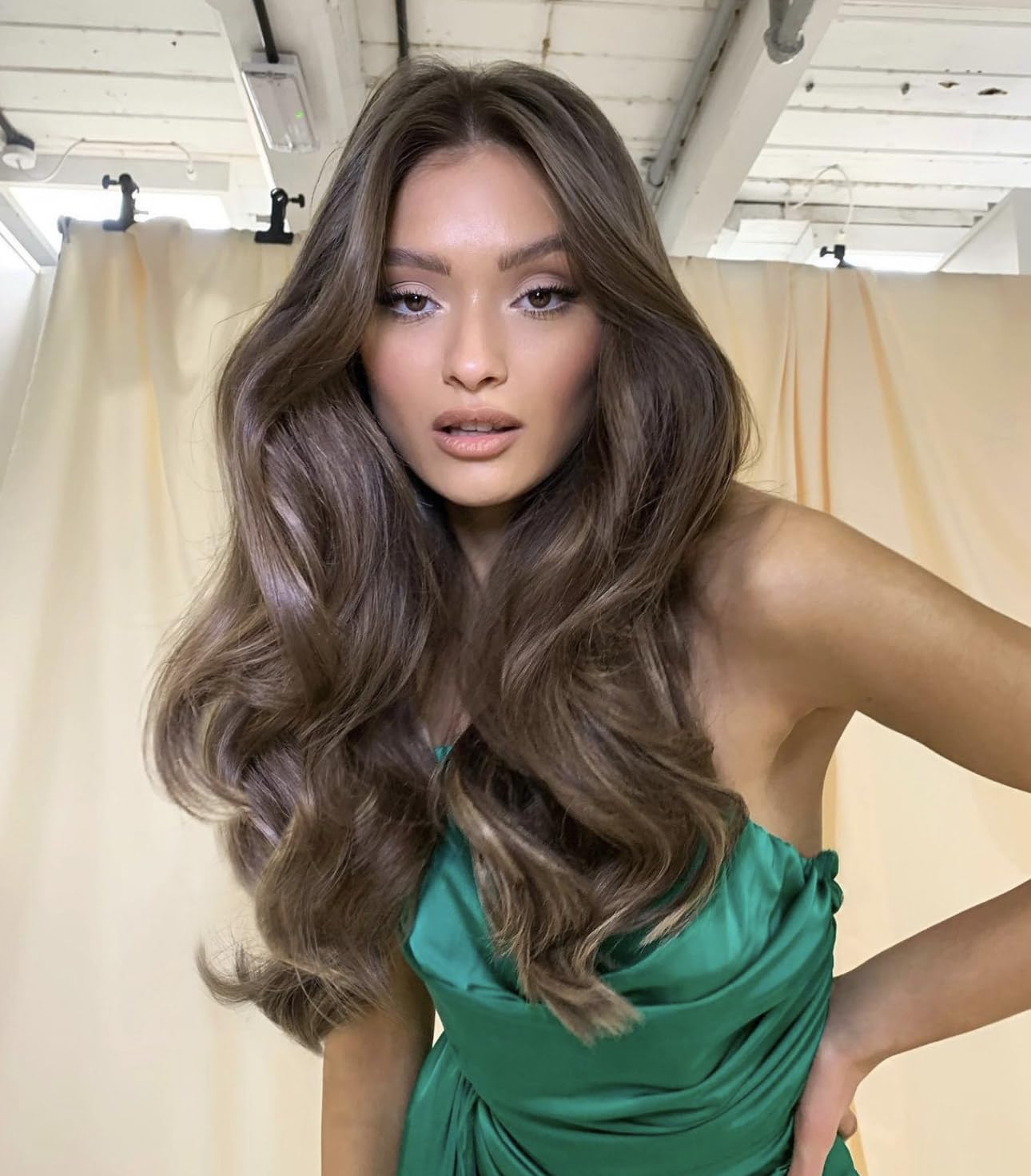Showcases the results of using a hair styling product through a customer-submitted image, providing social proof and inspiration.