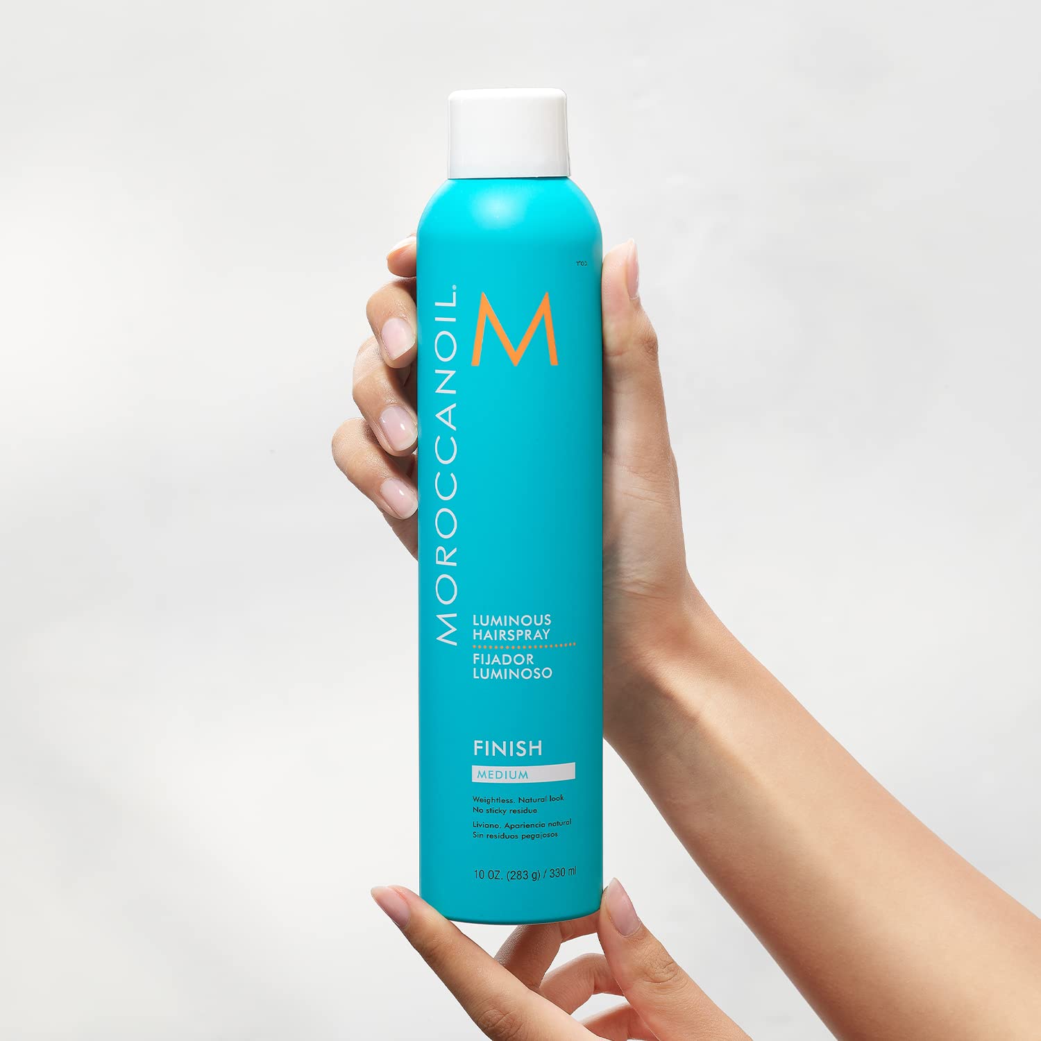 Highlights the product's ability to provide a luminous, shiny finish to hair.