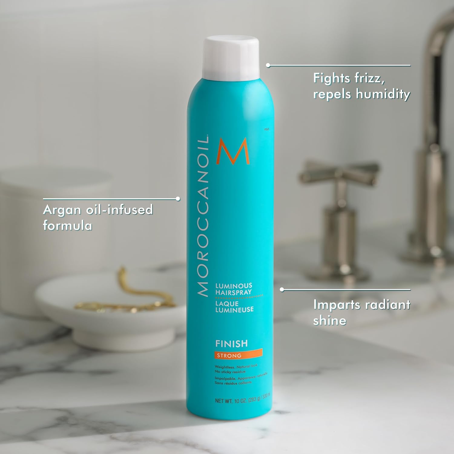 Highlights multiple benefits of the hairspray such as fighting frizz, repelling humidity, containing argan oil, and providing radiant shine.
