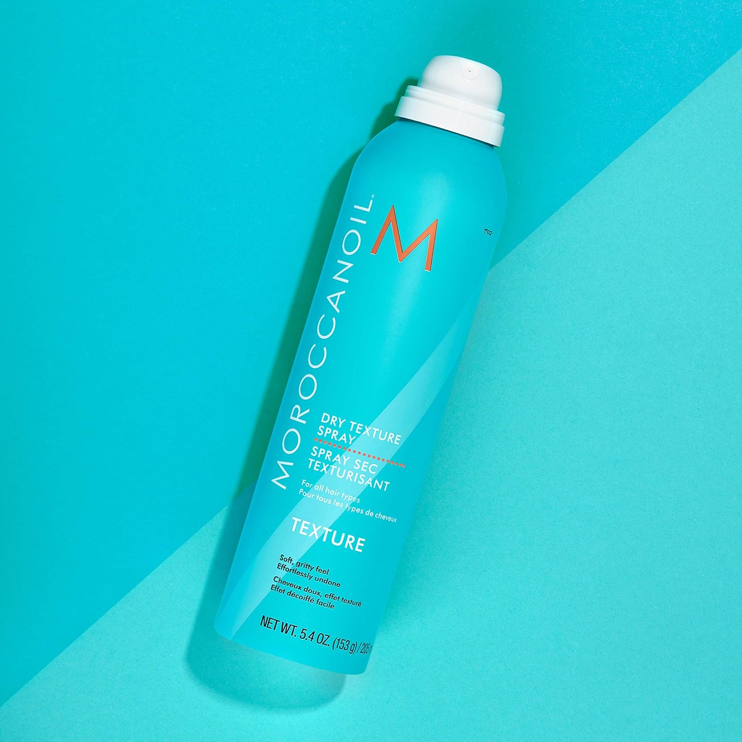 Highlights the product's ability to provide a dry, textured finish to hair.