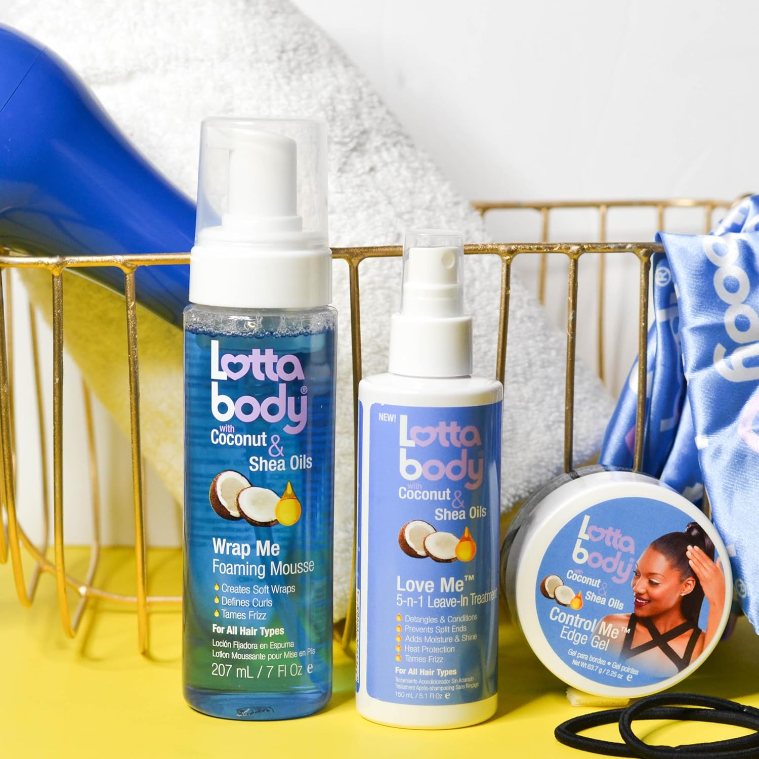 Shows the different hair care products included in the Lottabody Coconut & Shea Oils line, such as the Wrap Me Foaming Mousse, Love Me Leave-In Treatment, and Control Me Edge Gel.