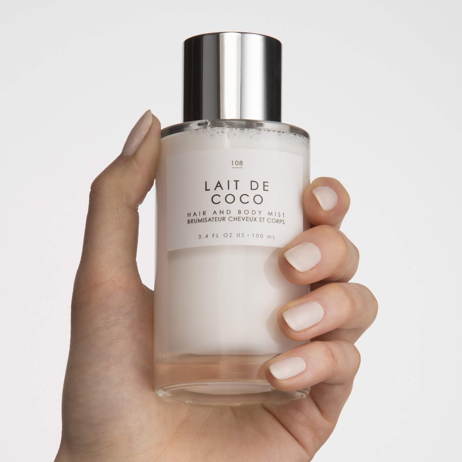 Shows a customer's perspective and real-life use of the coconut milk hair product, building trust and authenticity.