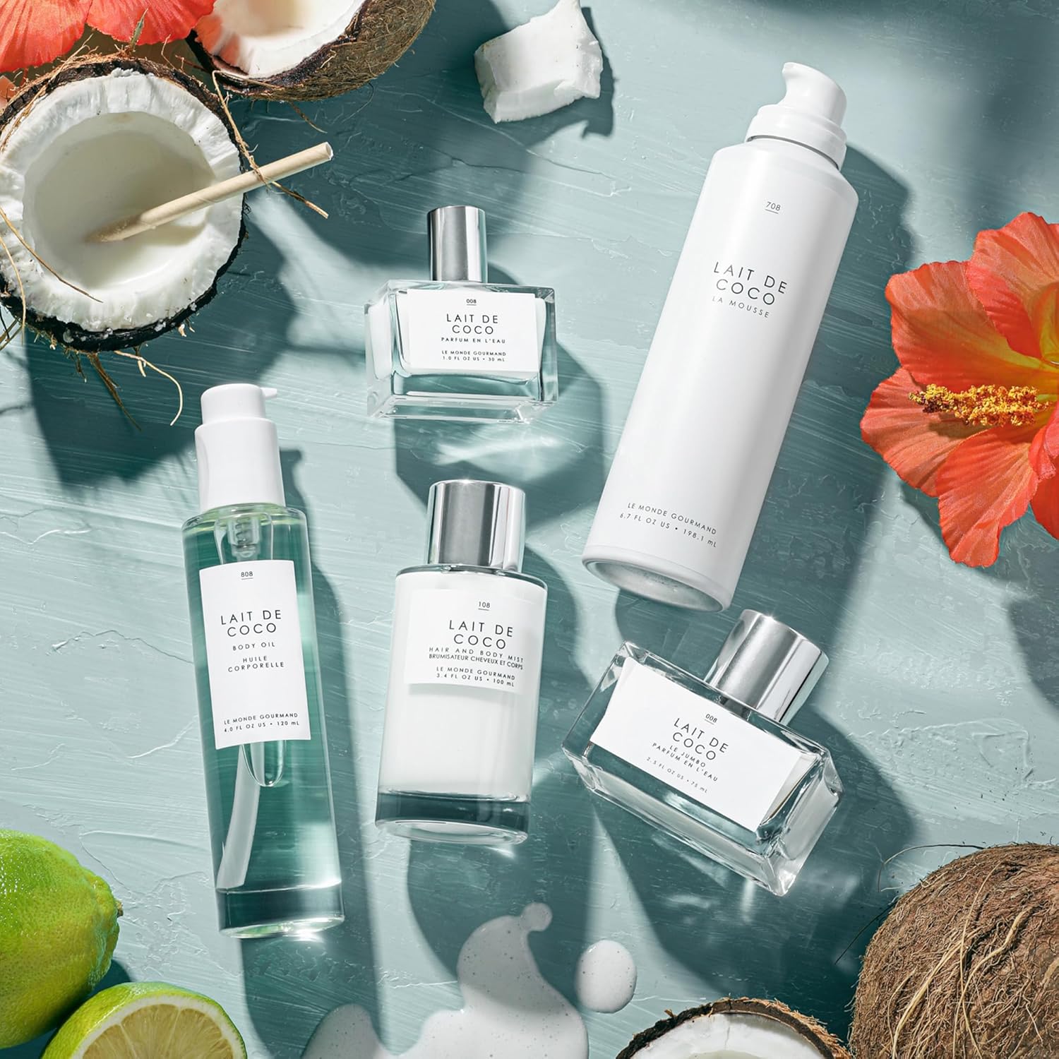 Shows the various coconut-based beauty products included in the brand's line, such as body lotion, hair oil, body wash, and fragrance.