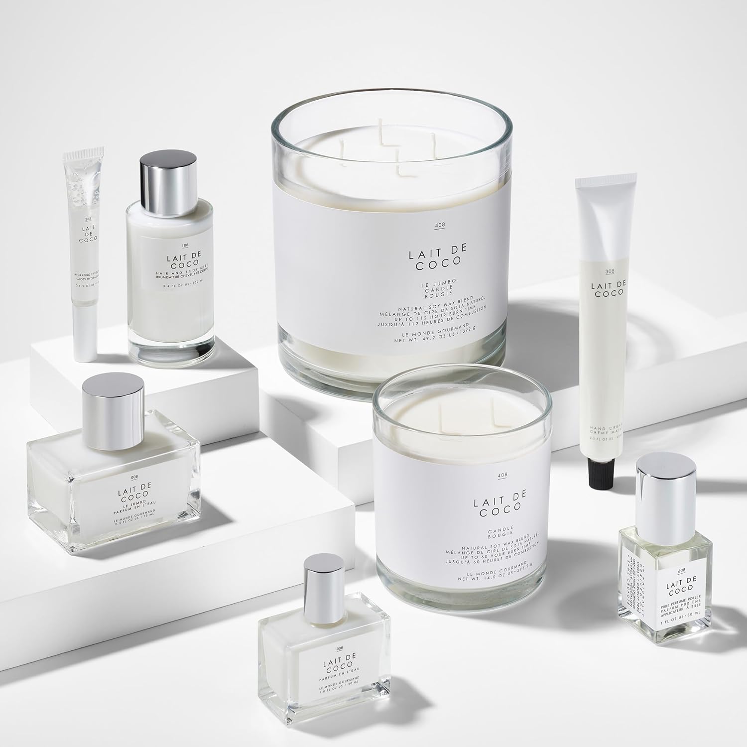 Shows the various products included in the Lait de Coco line, such as candles, lotions, and fragrances, to highlight the full range of offerings.